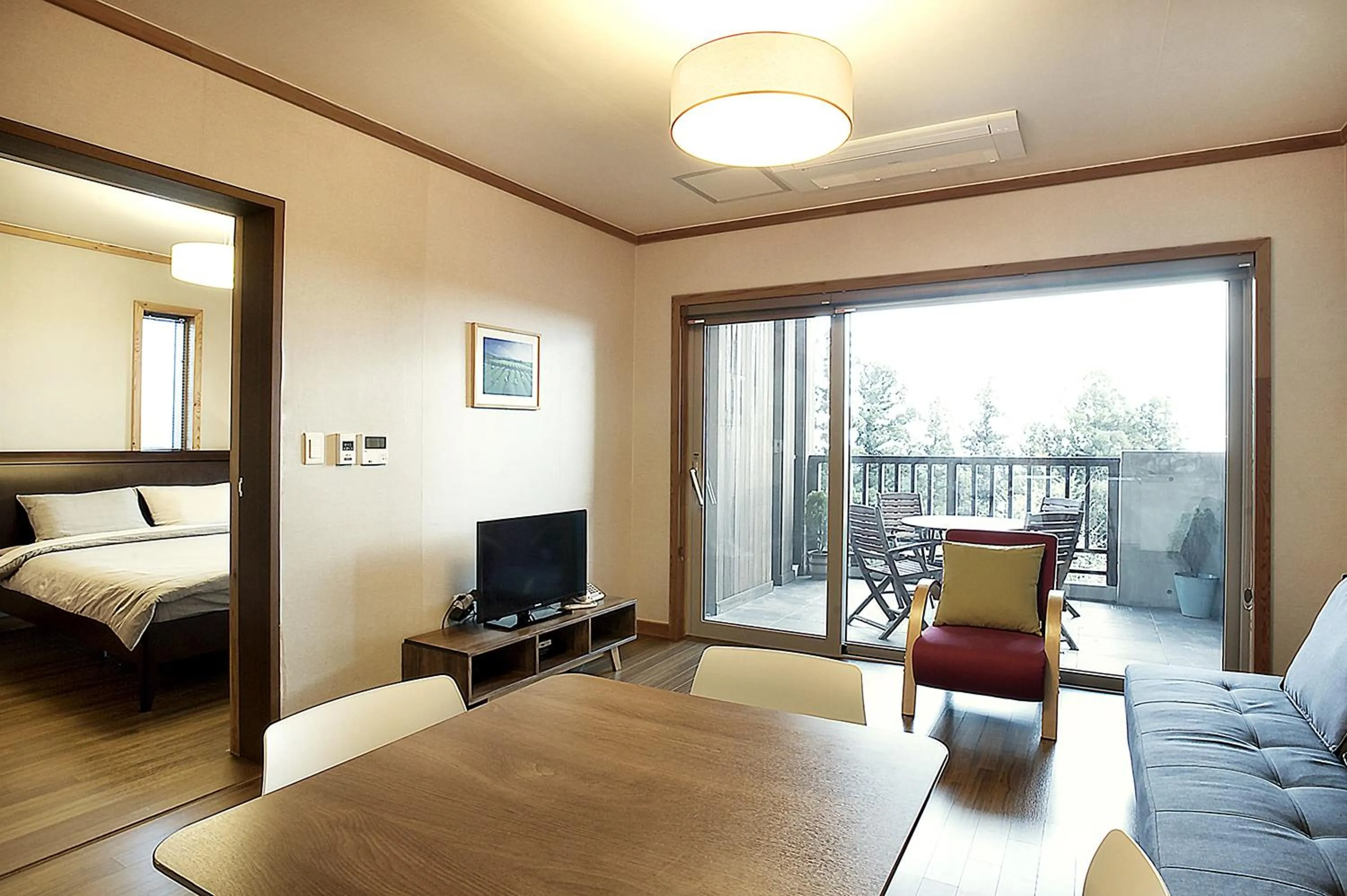 Living room, Bed in Jeju Eco Suites