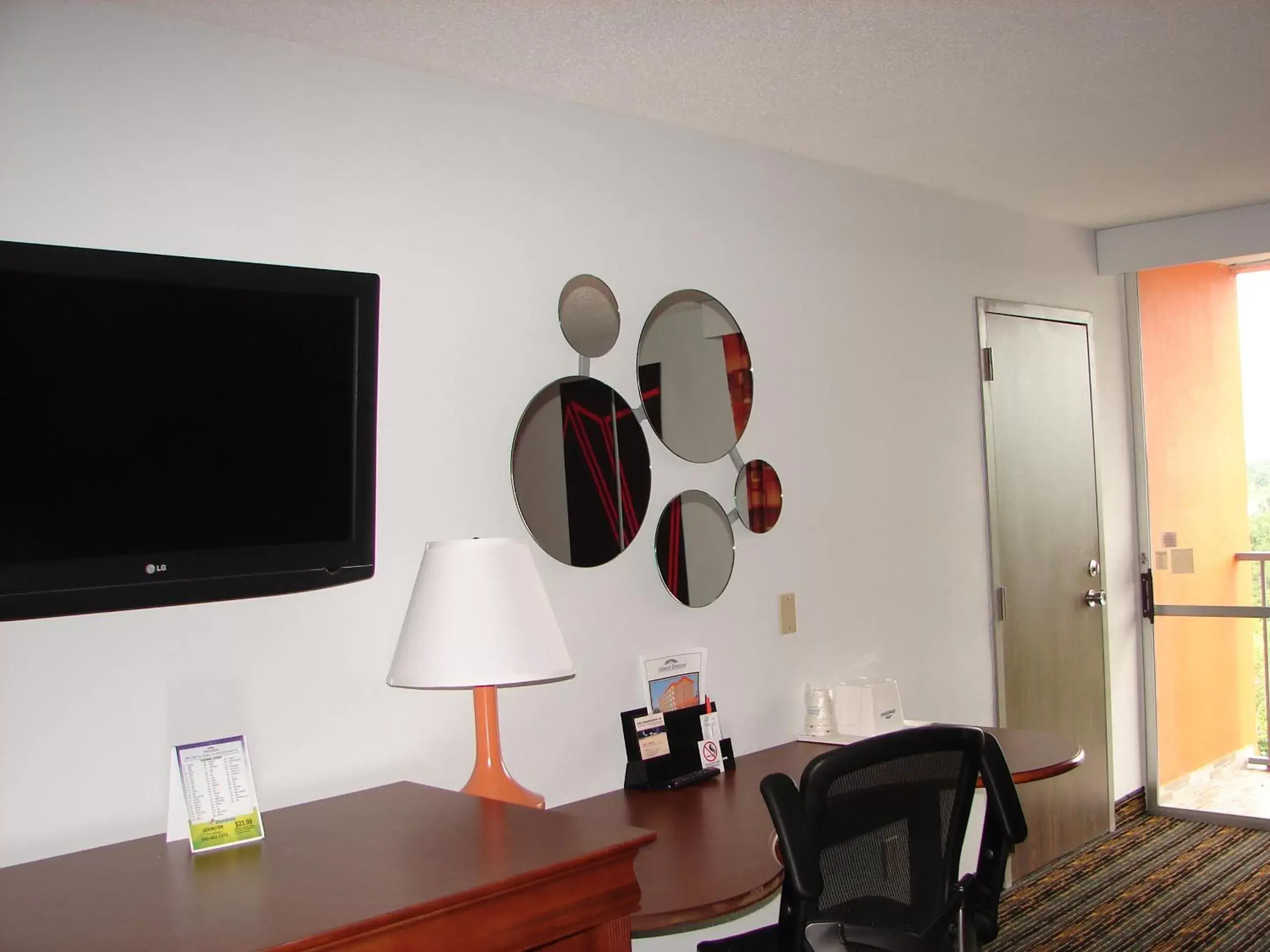 TV and multimedia, TV/Entertainment Center in Howard Johnson by Wyndham Lexington