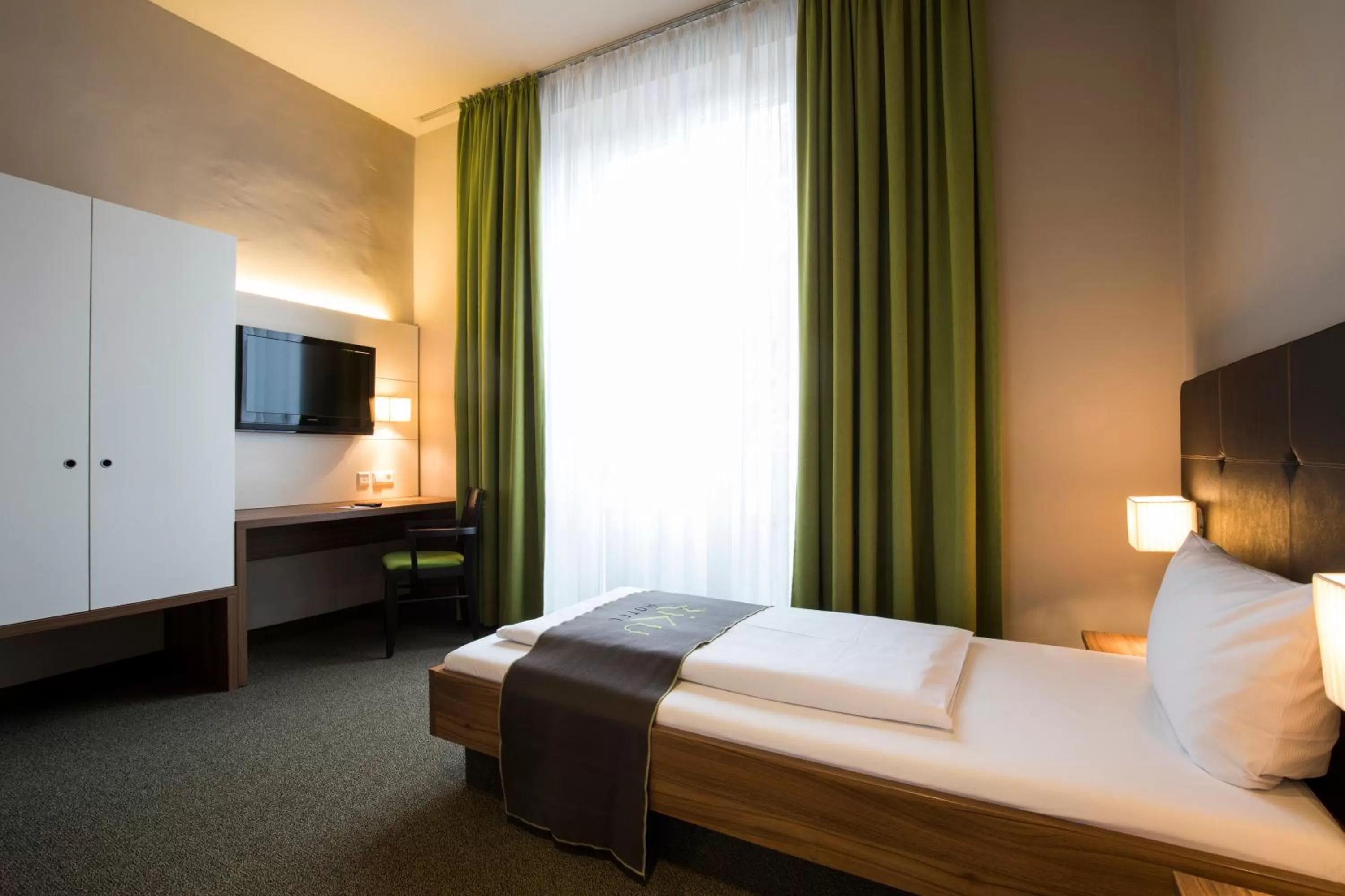 Photo of the whole room, Bed in RiKu HOTEL Neu-Ulm