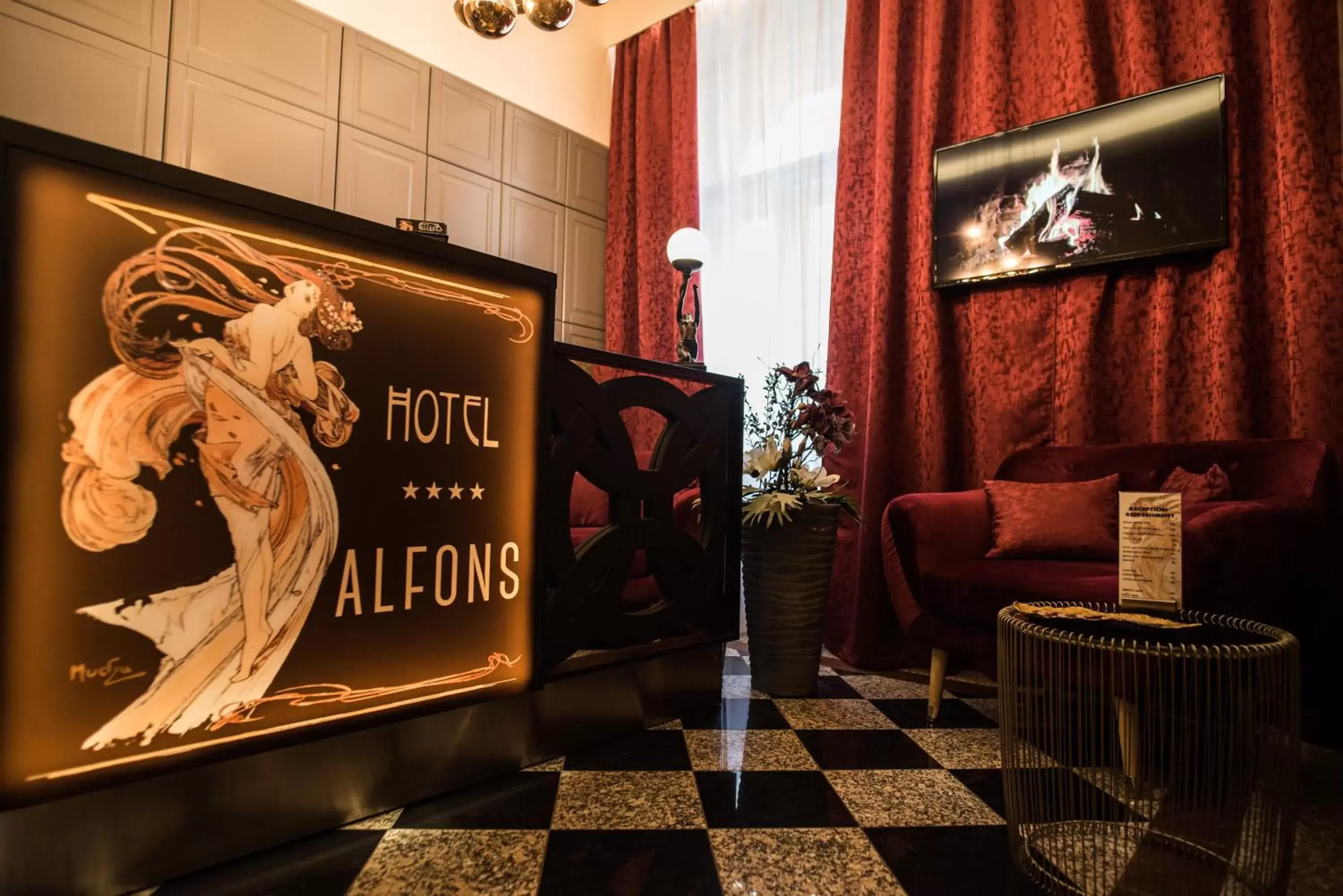 Lobby or reception in Alfons Boutique Hotel