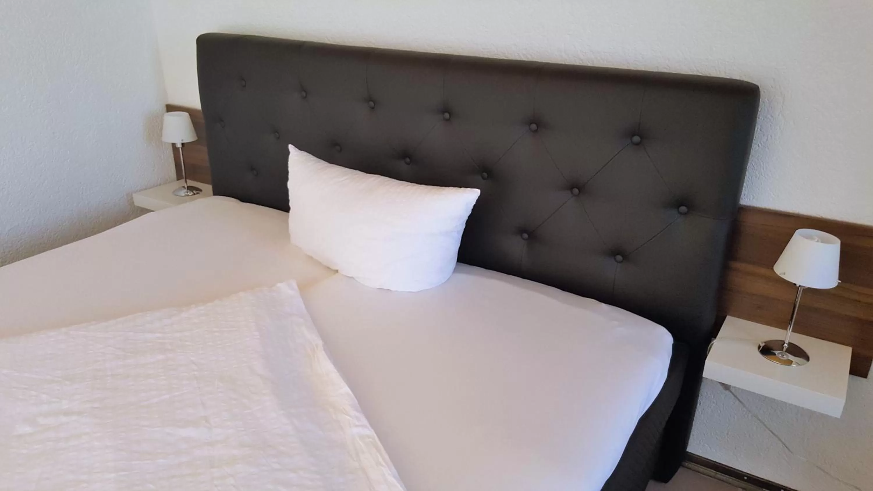 Bed in Hotel Exquisite