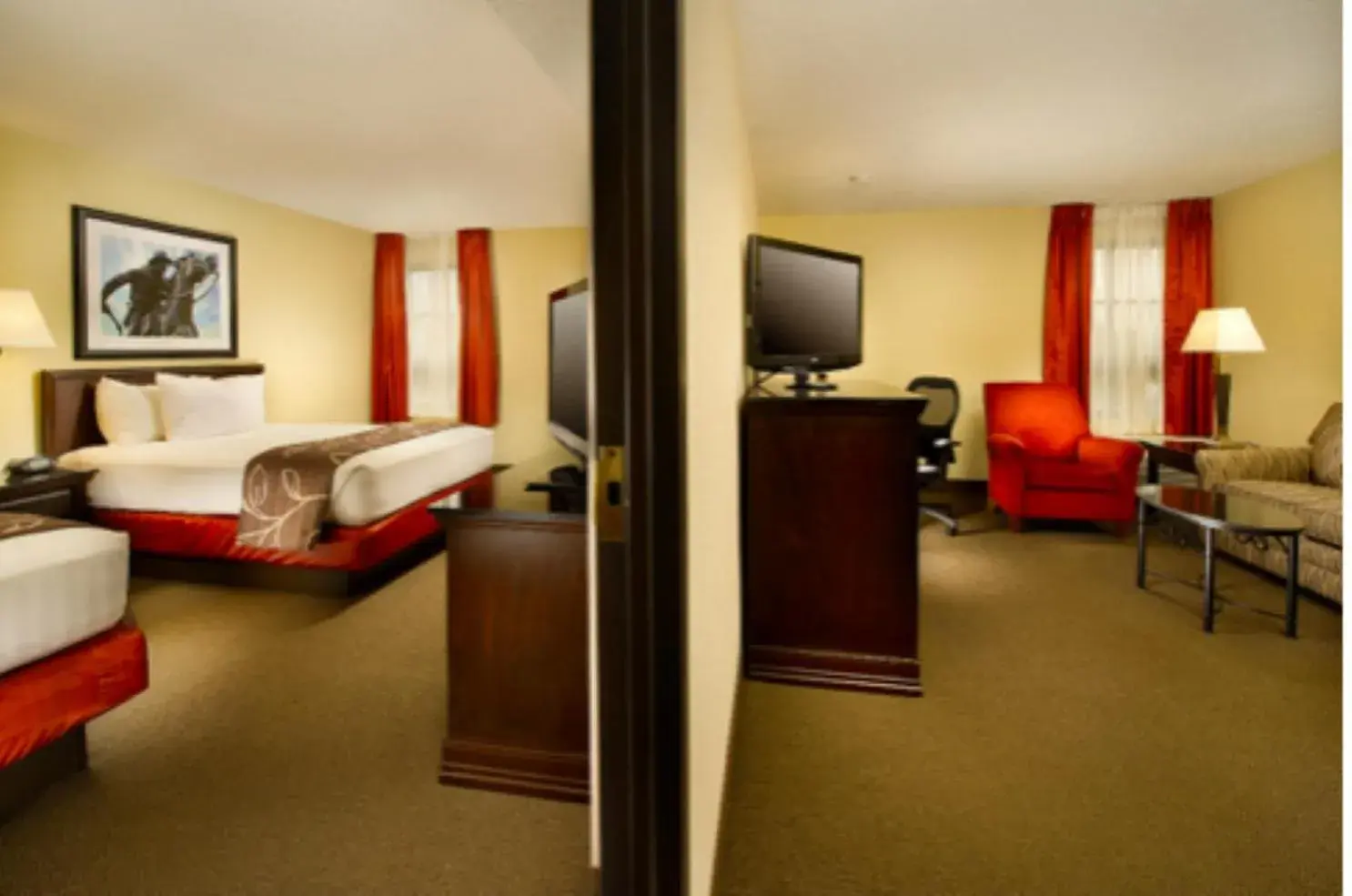 Bed, TV/Entertainment Center in Hotel Lotus Kansas City Merriam