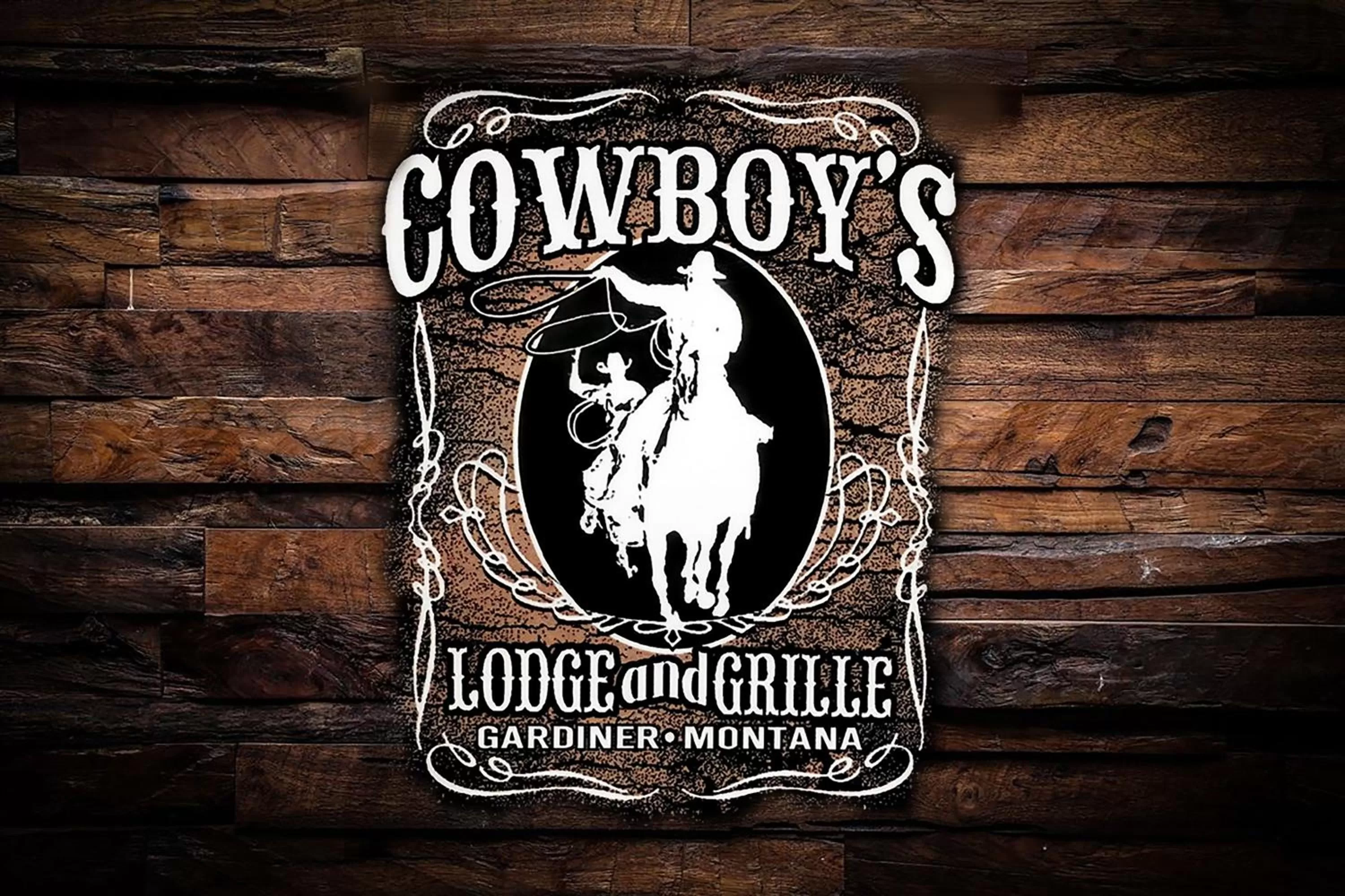 Property logo or sign in Cowboy's Lodge