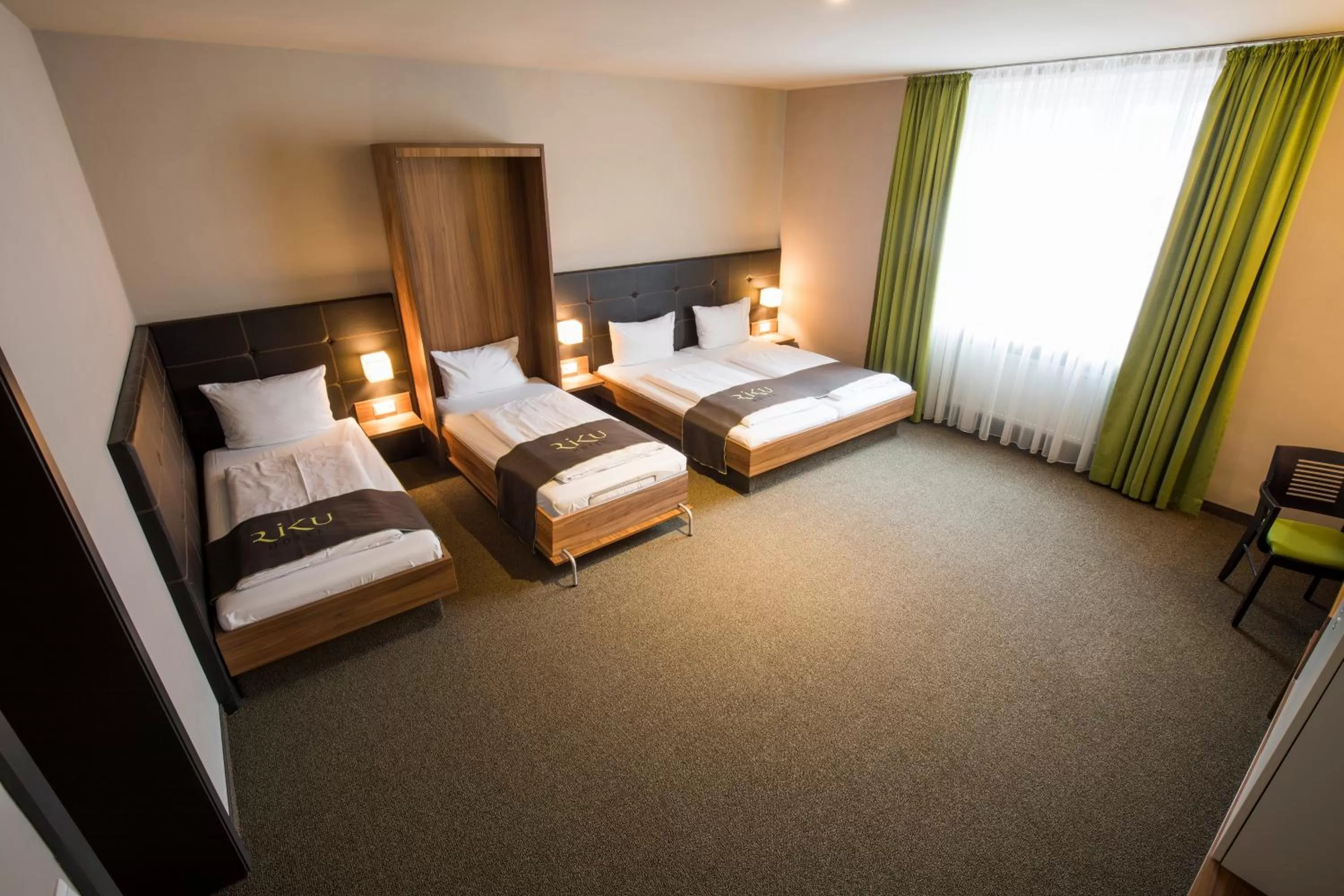 Photo of the whole room, Bed in RiKu HOTEL Neu-Ulm