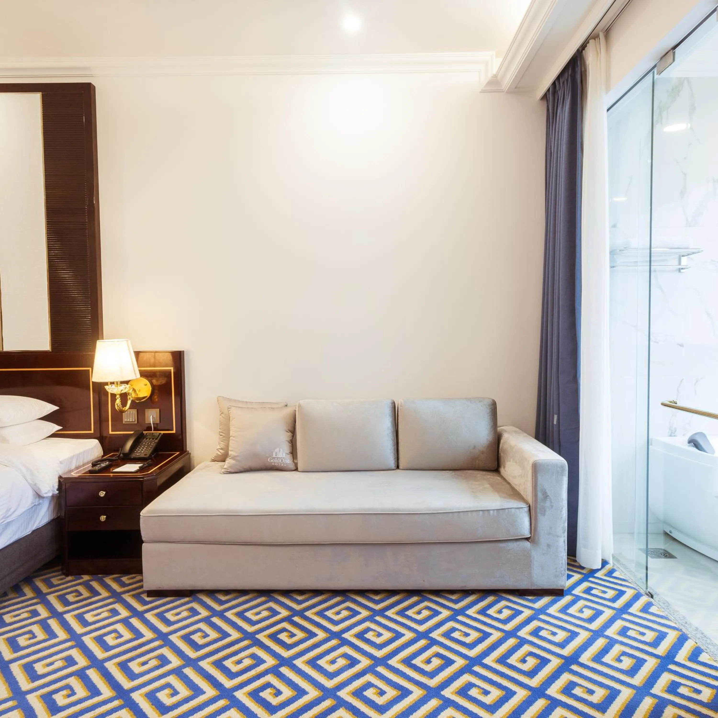 Bed in GoldOne Hotel & Suites