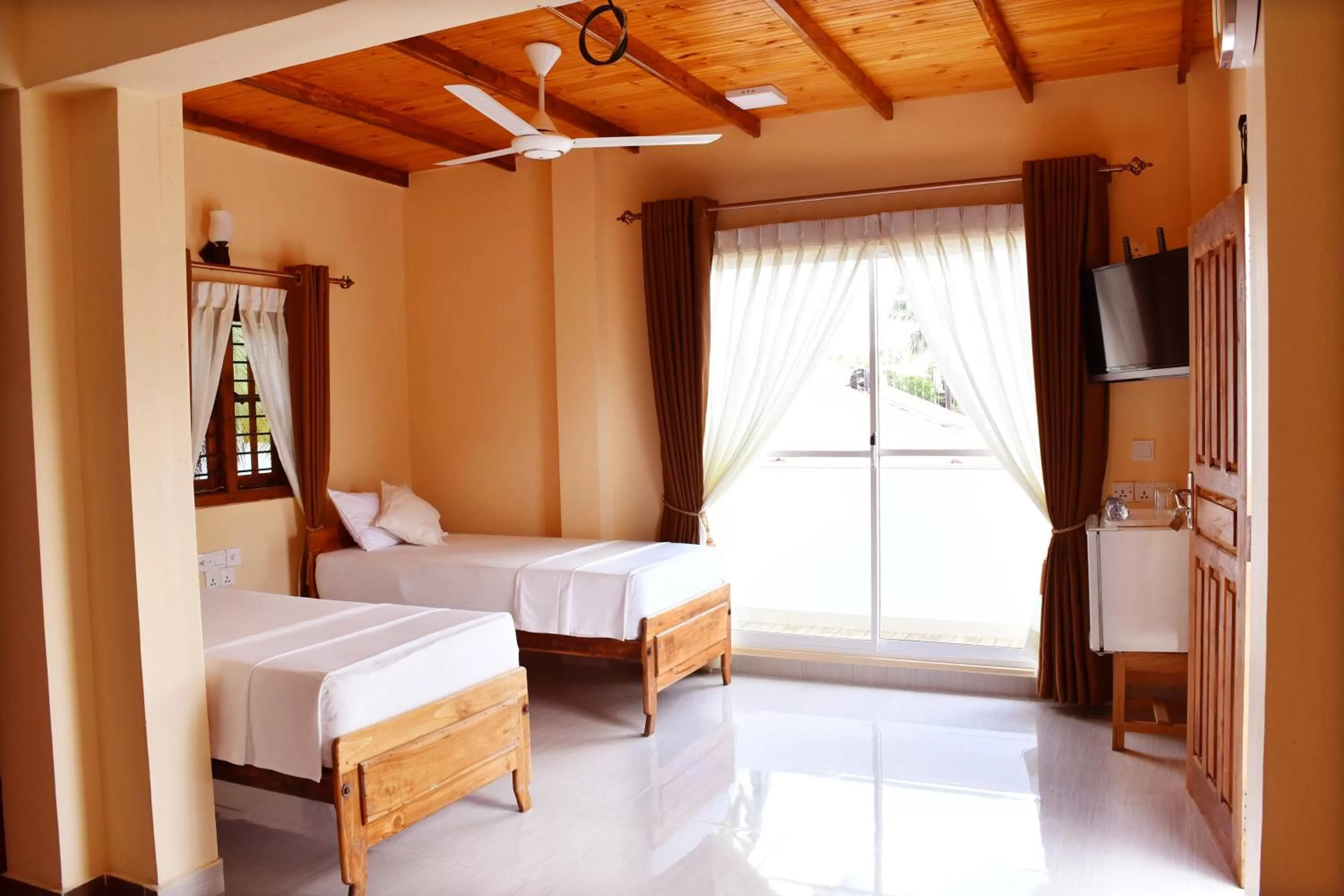 Bed in Bluewater Beach Resort