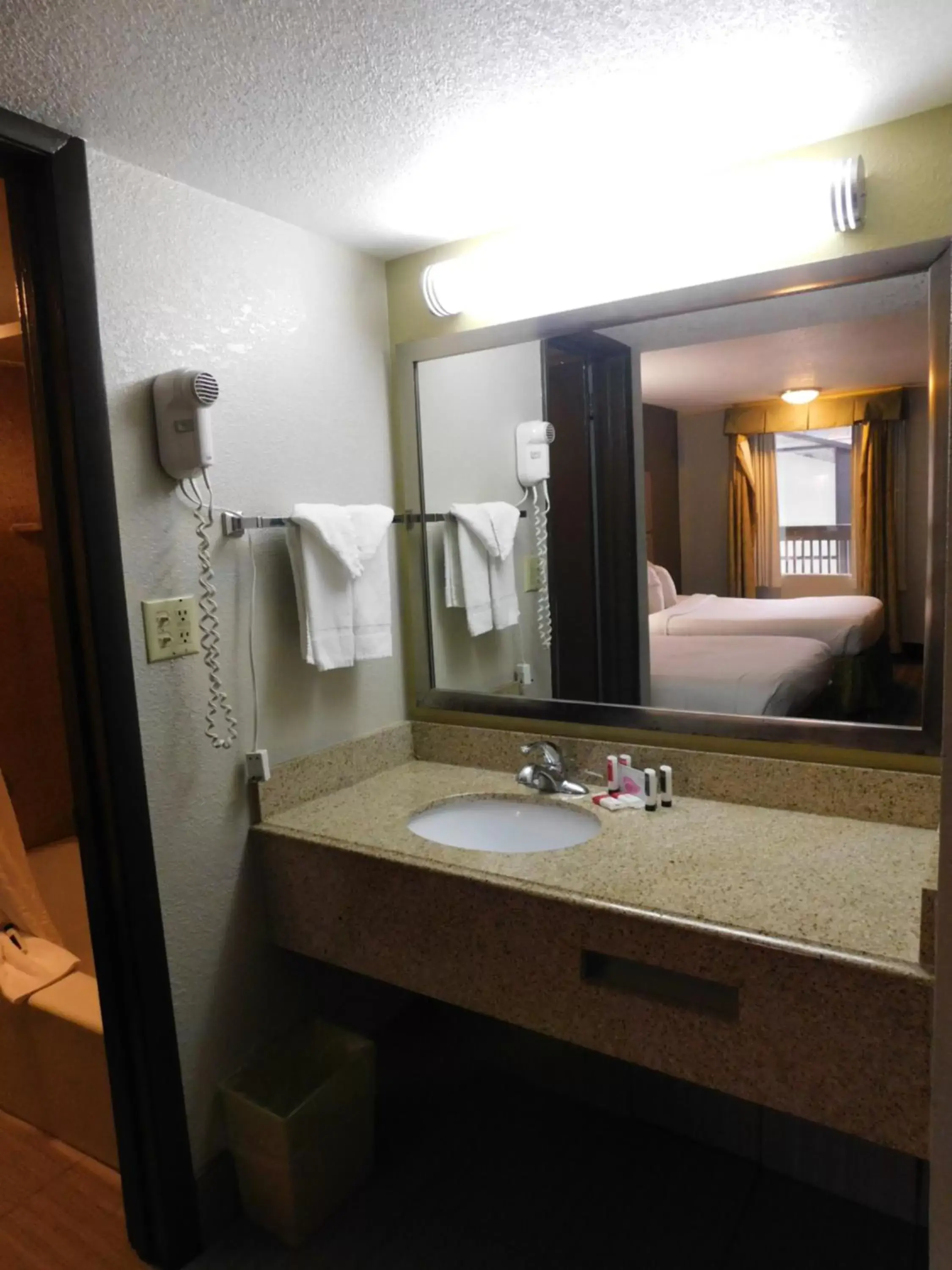 Bathroom in Days Inn & Suites by Wyndham Downtown Gatlinburg Parkway