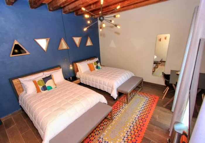 Bed in Antigua Trece Hotel Fusión