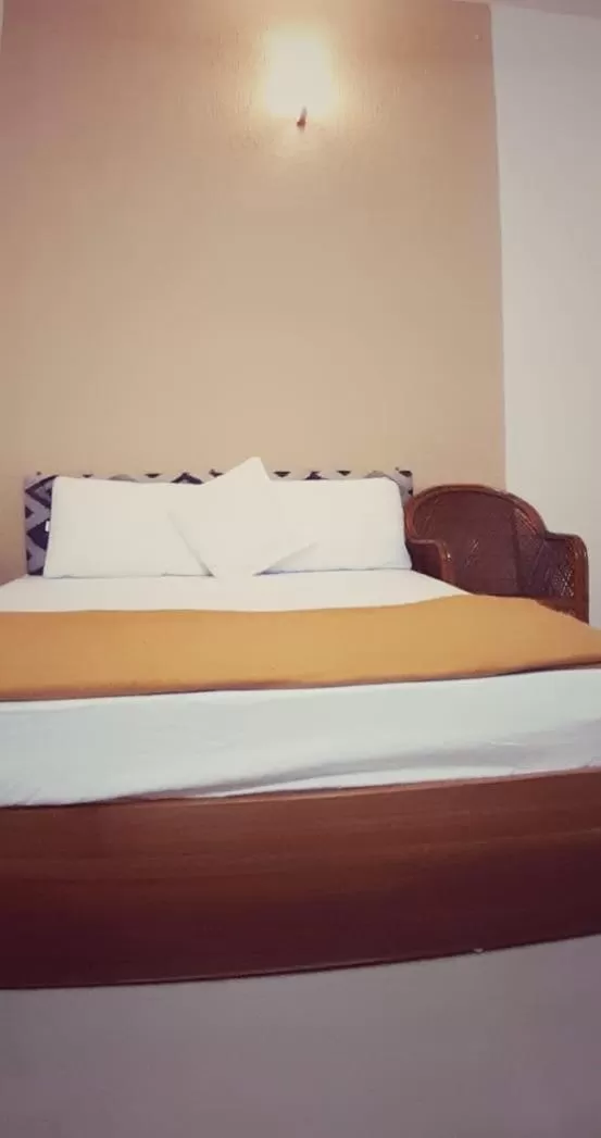 Photo of the whole room, Bed in Thenmala Heritage