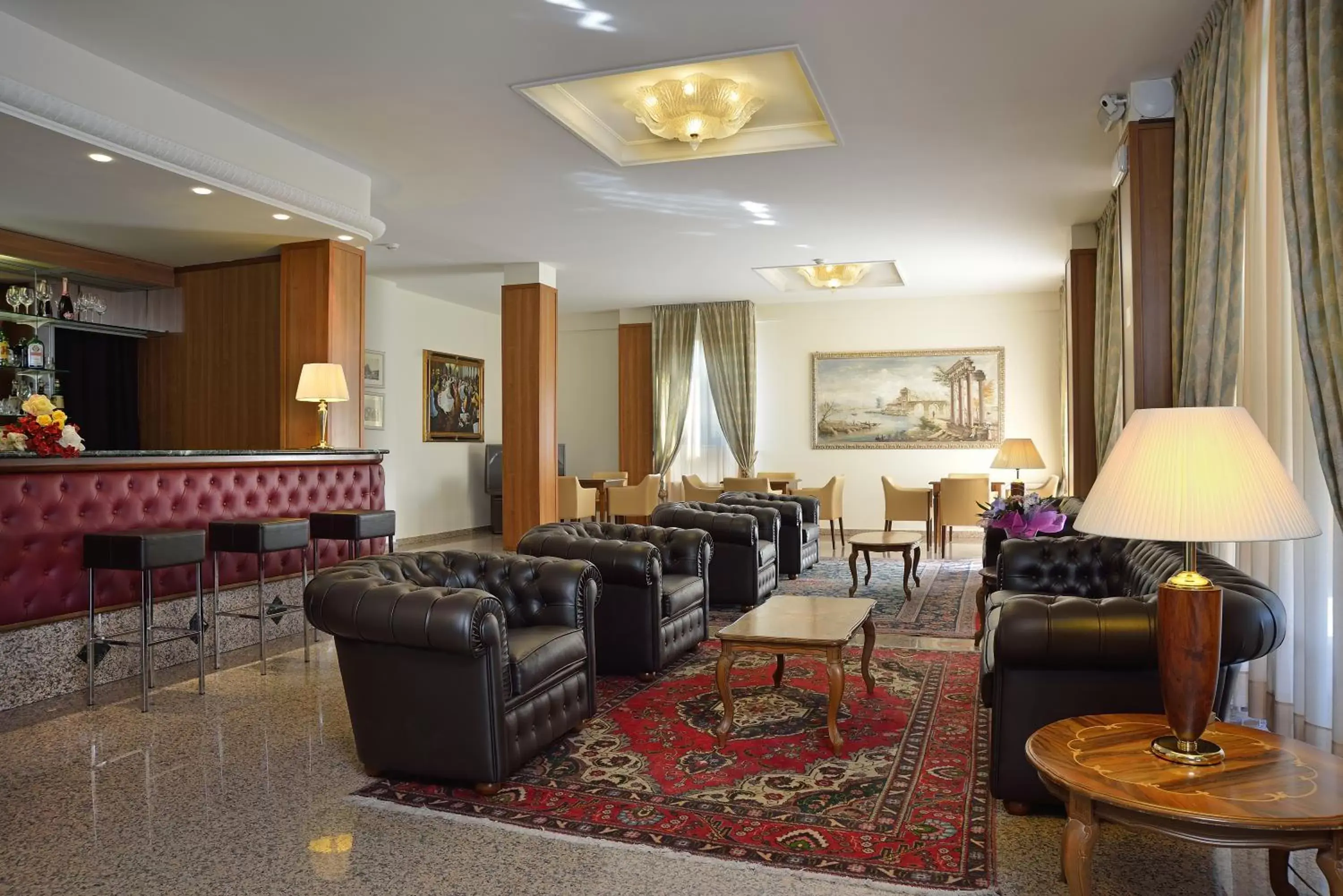 Communal lounge/ TV room, Seating Area in Hotel Rossini