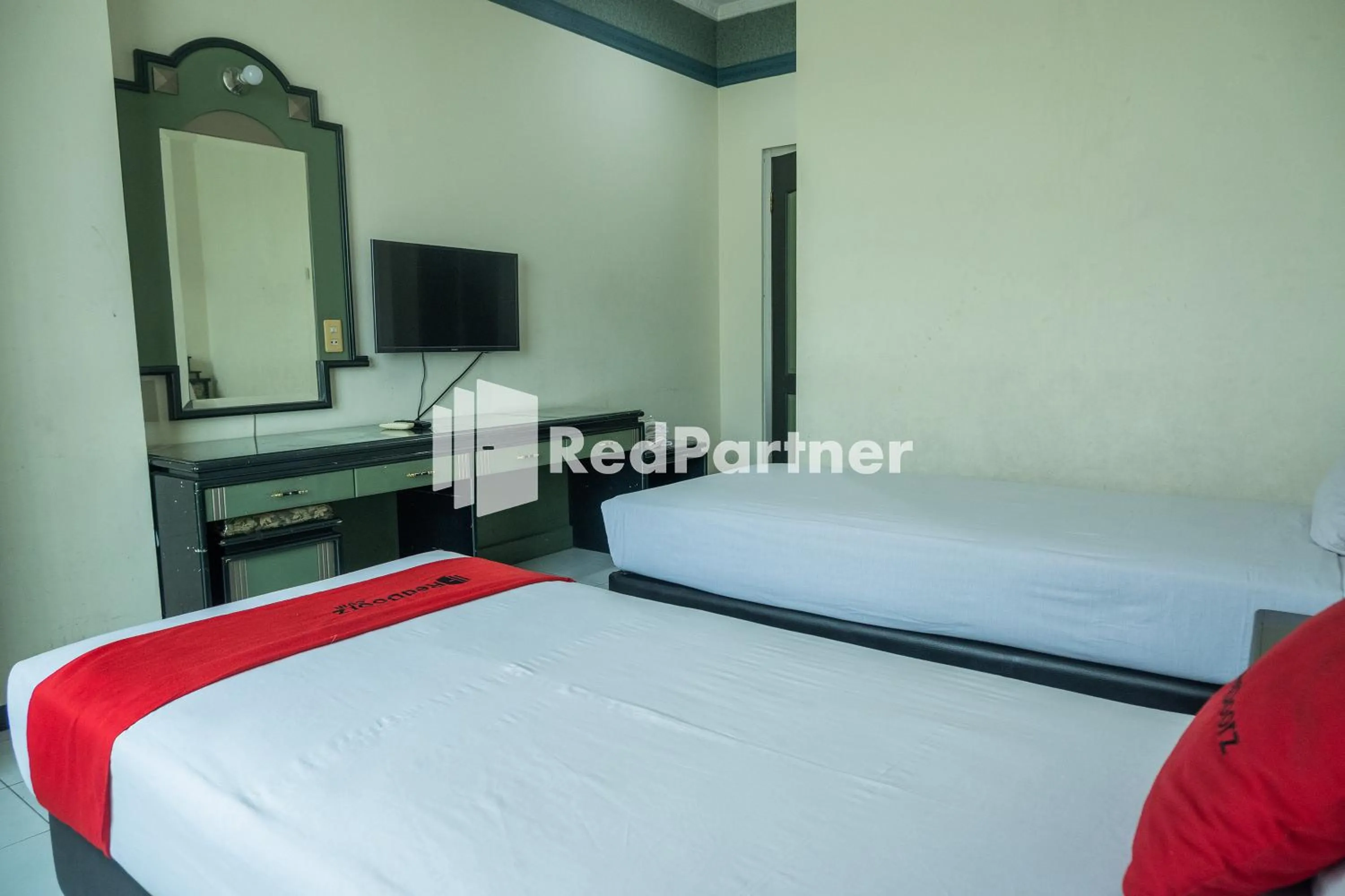 Bed in Akur Hotel Malioboro Mitra RedDoorz