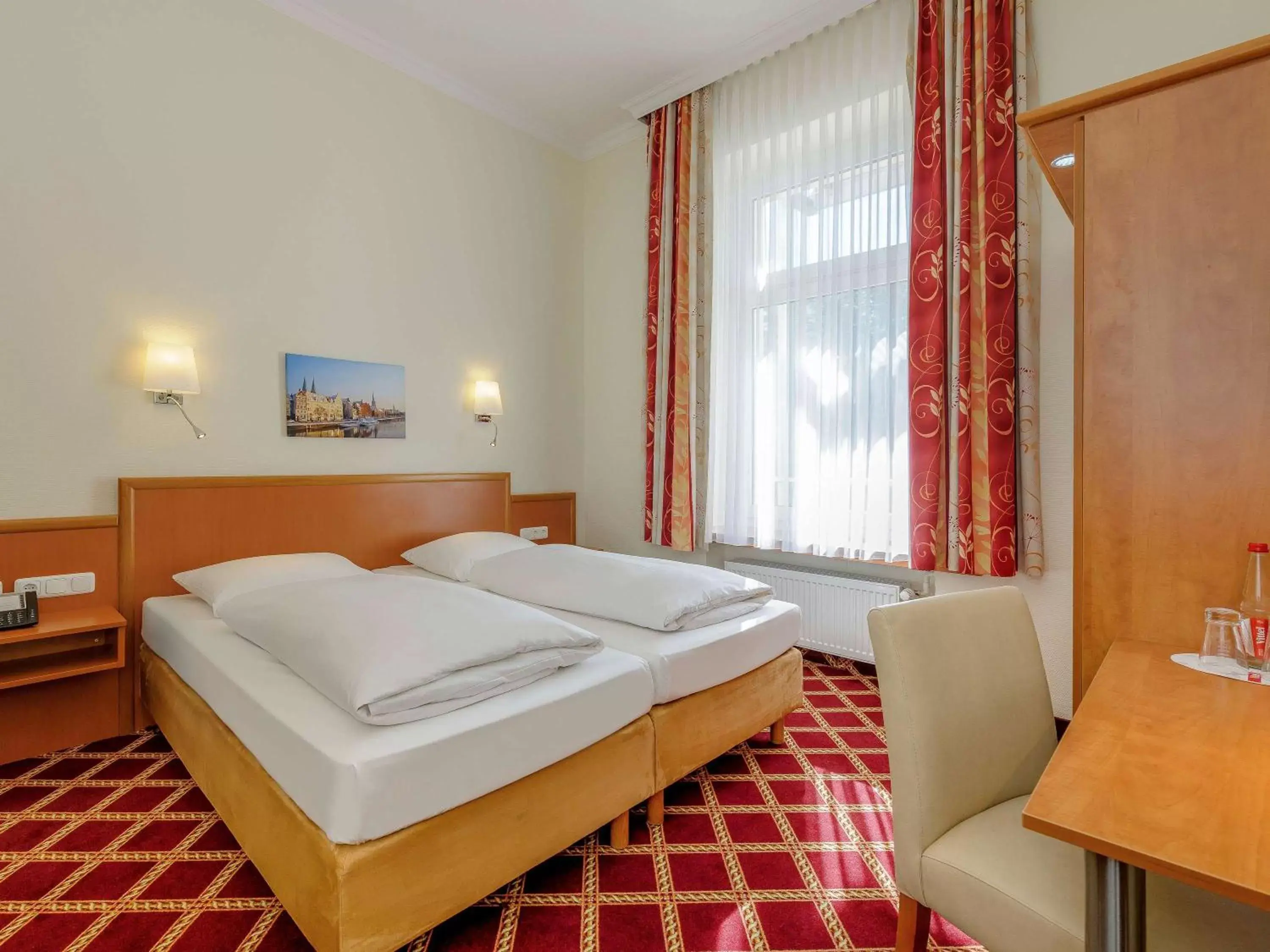 Photo of the whole room, Bed in Mercure Hotel Luebeck City Center