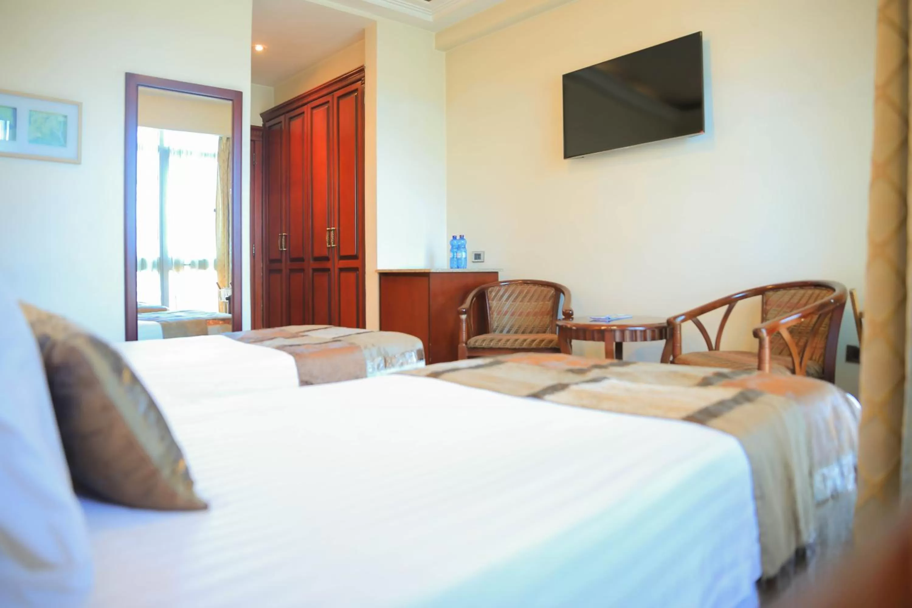 City view, Bed in Swiss Inn Nexus Hotel