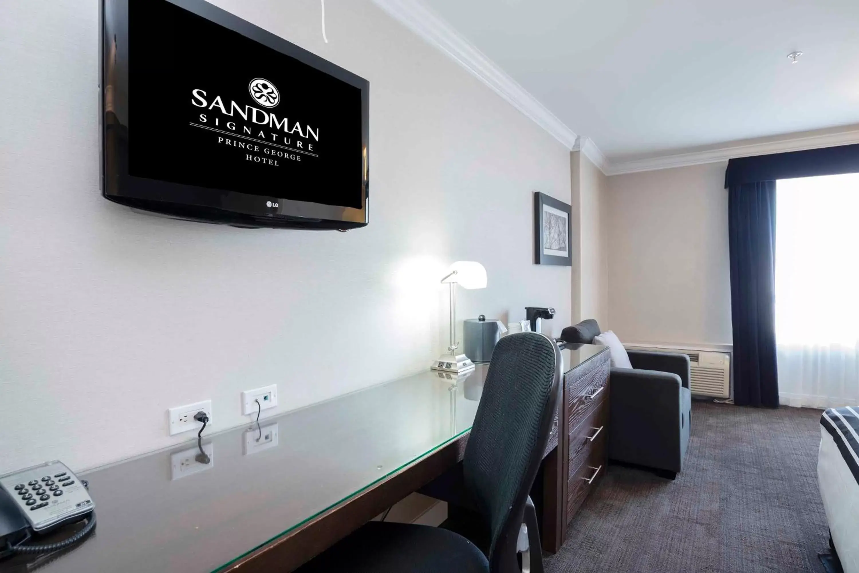 Photo of the whole room, TV/Entertainment Center in Sandman Signature Prince George Hotel