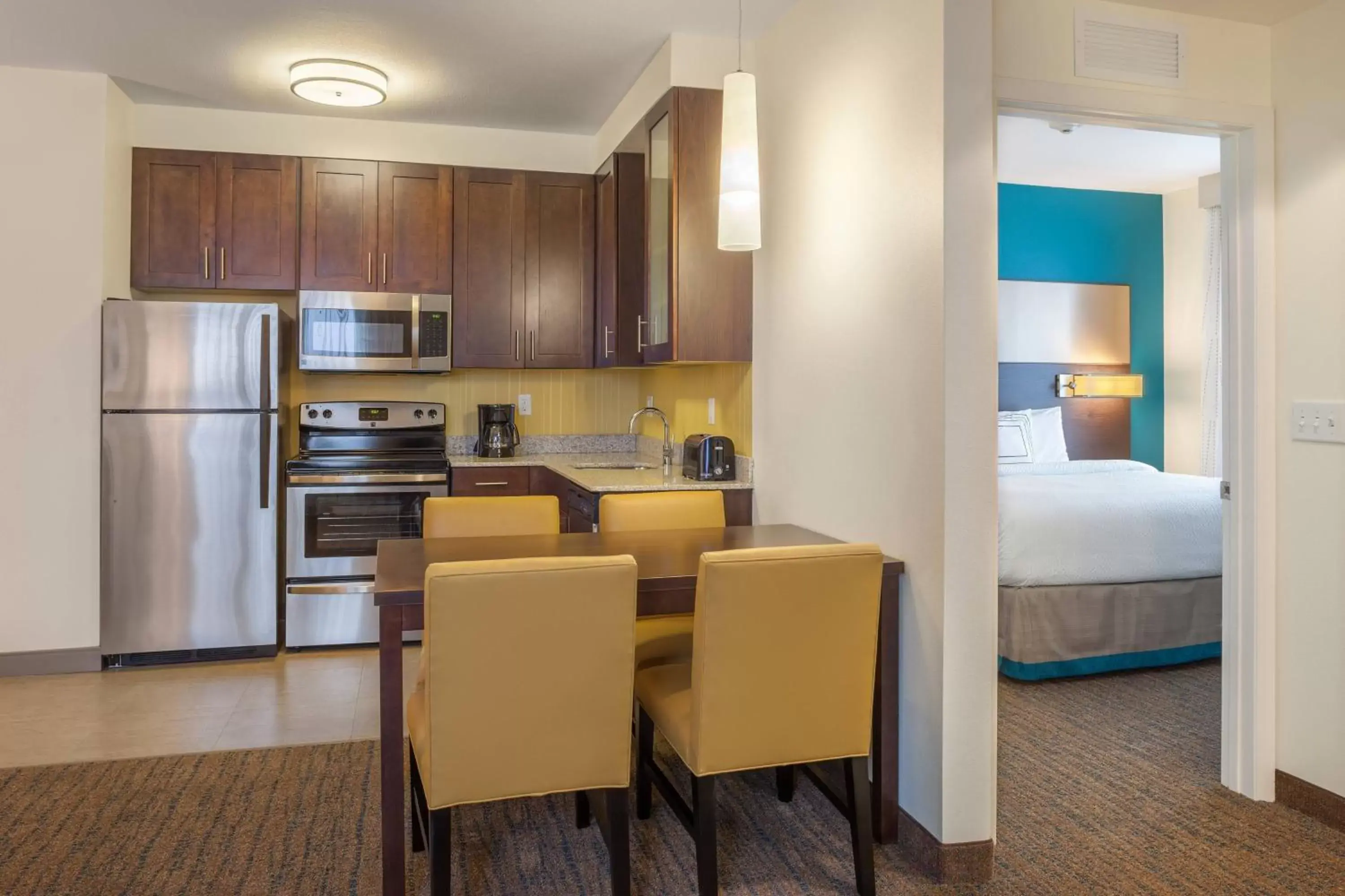Bedroom, Kitchen/Kitchenette in Residence Inn by Marriott Orlando Downtown