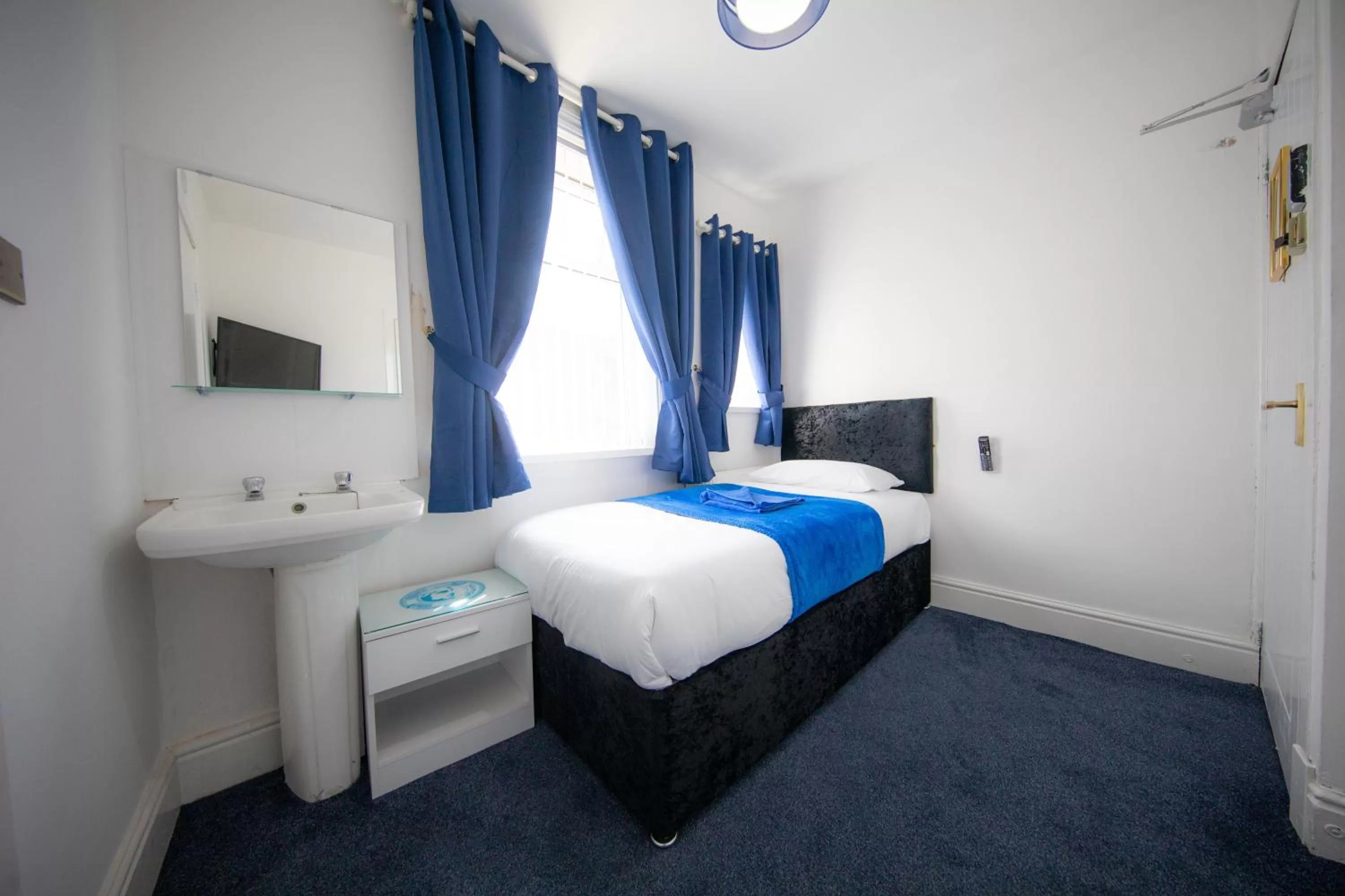 Bed in The Adonis Hotel