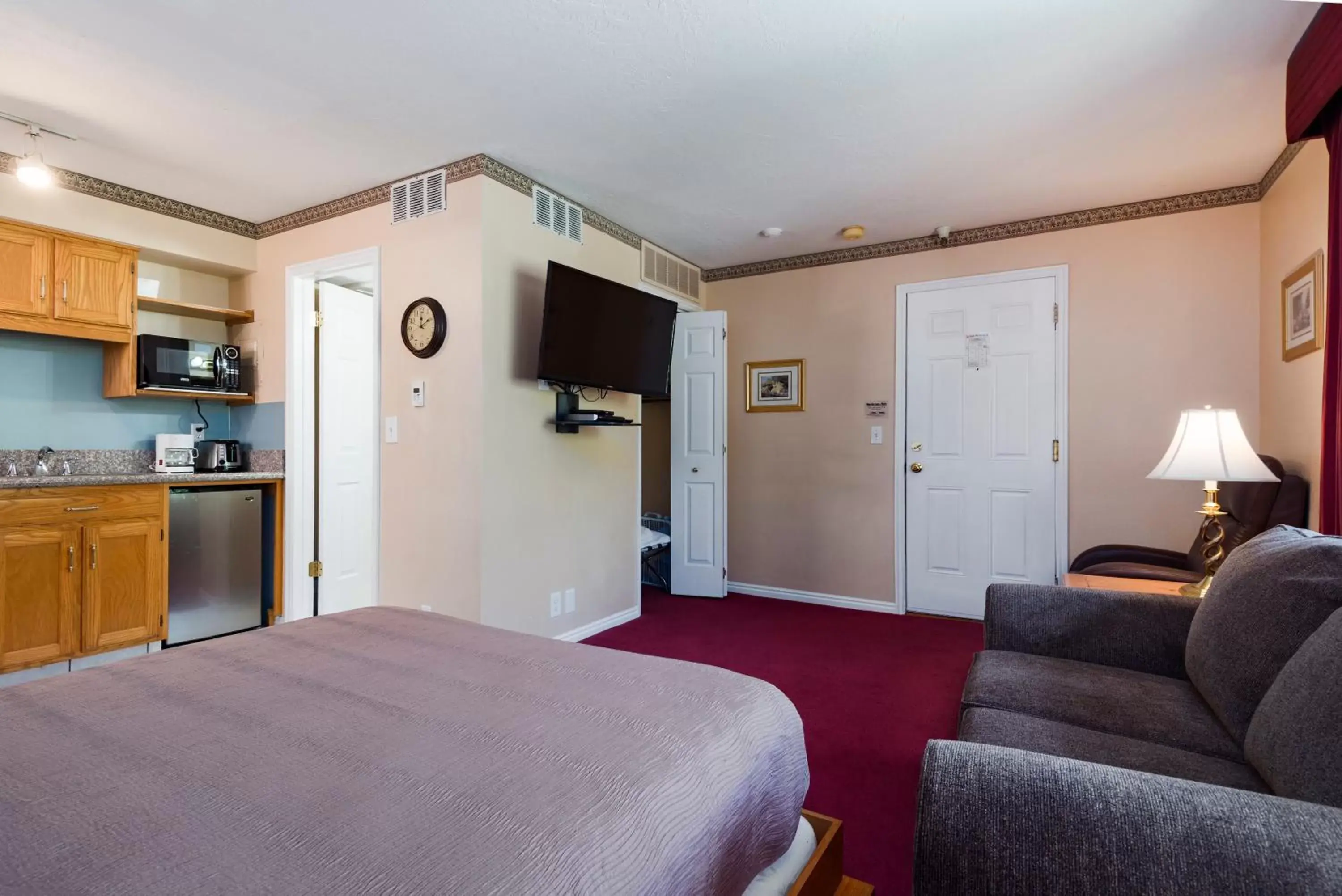 Bed, TV/Entertainment Center in The Kimball at Temple Square