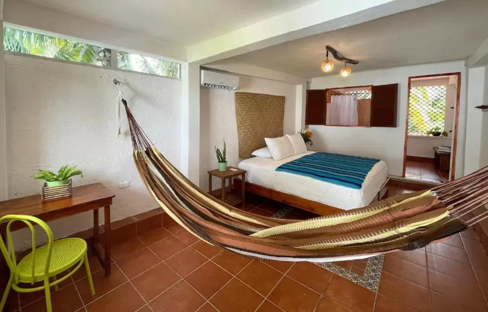 Bedroom, Bed in Hotel Villas Colibrí Suites & Bungalows