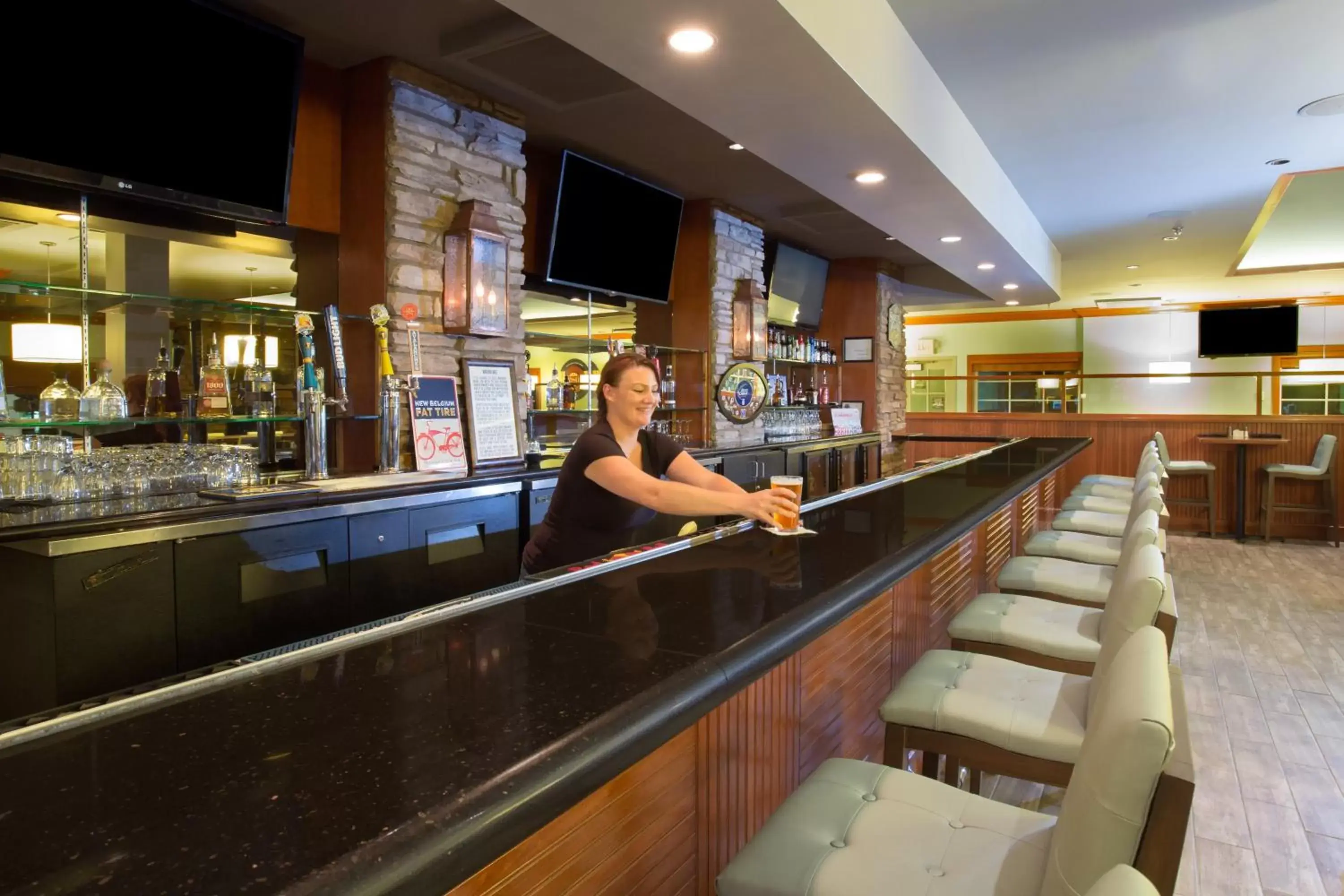 Lounge or bar, Lounge/Bar in Holiday Inn Colorado Springs - Airport, an IHG Hotel