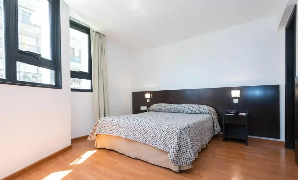 Bed in Urquiza Apart Hotel & Suites