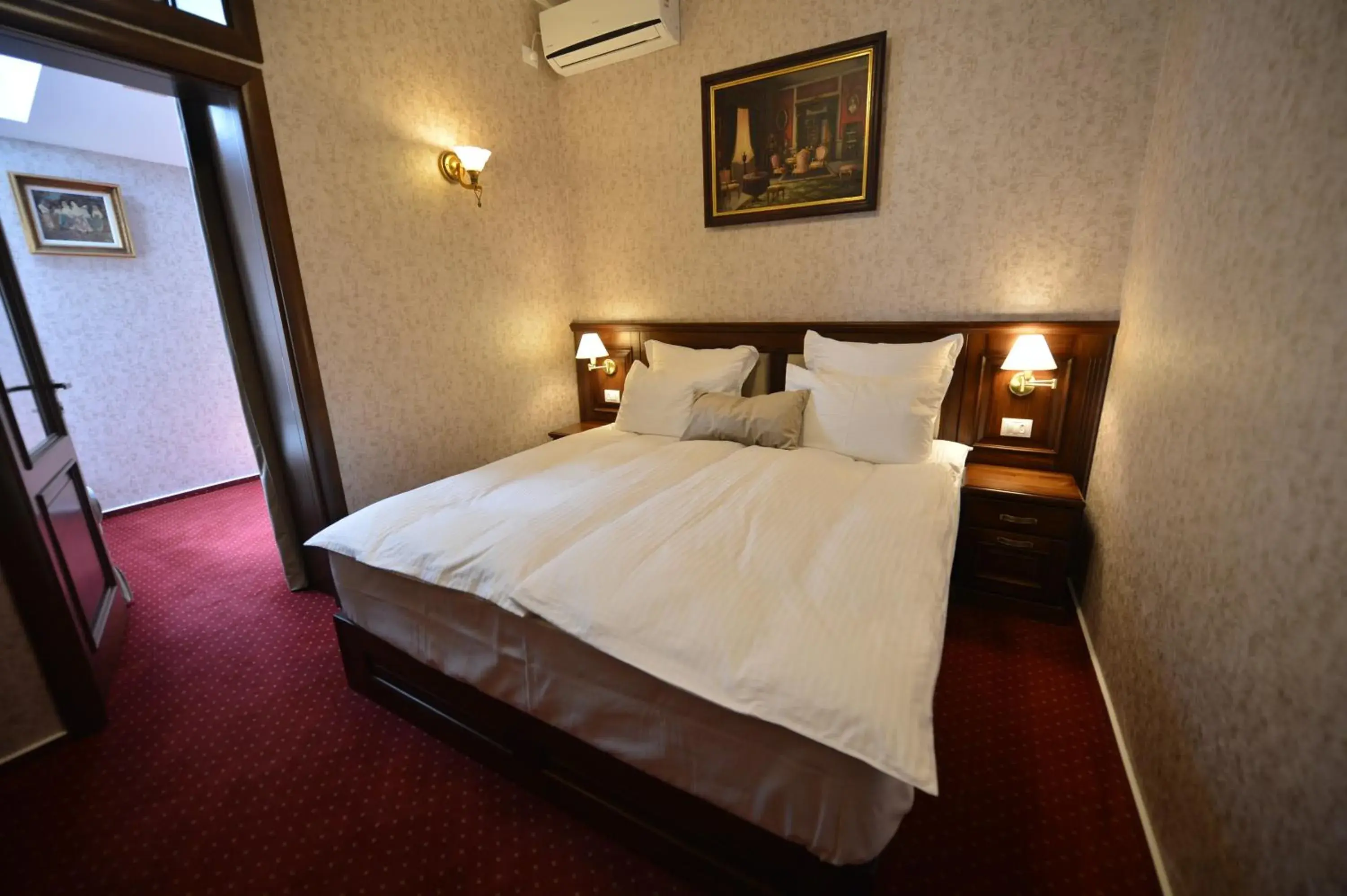 Bed in Noblesse Boutique Hotel