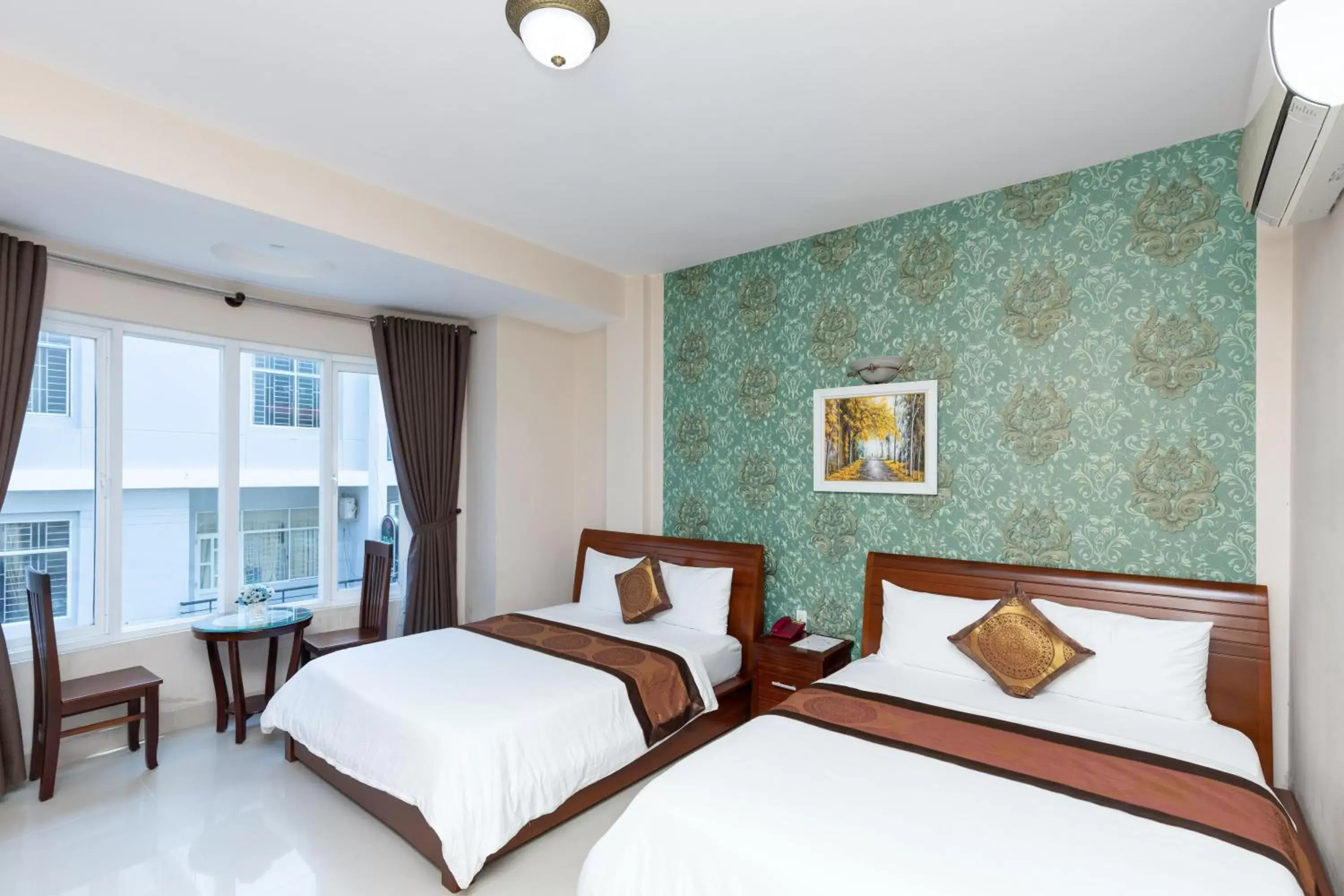 Bed in Queen Garden Hotel & Apartment