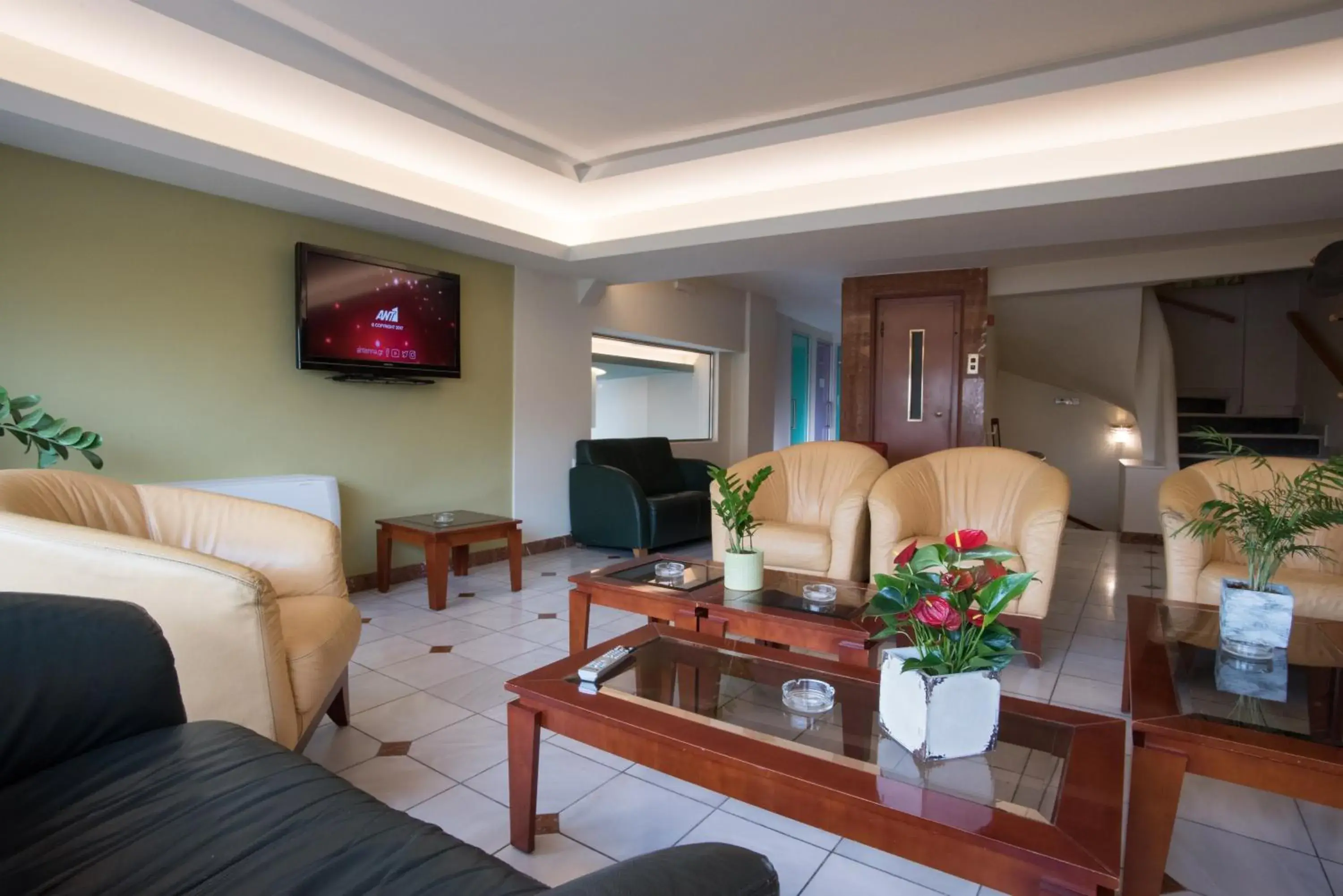 Communal lounge/ TV room, Seating Area in Morfeas Hotel