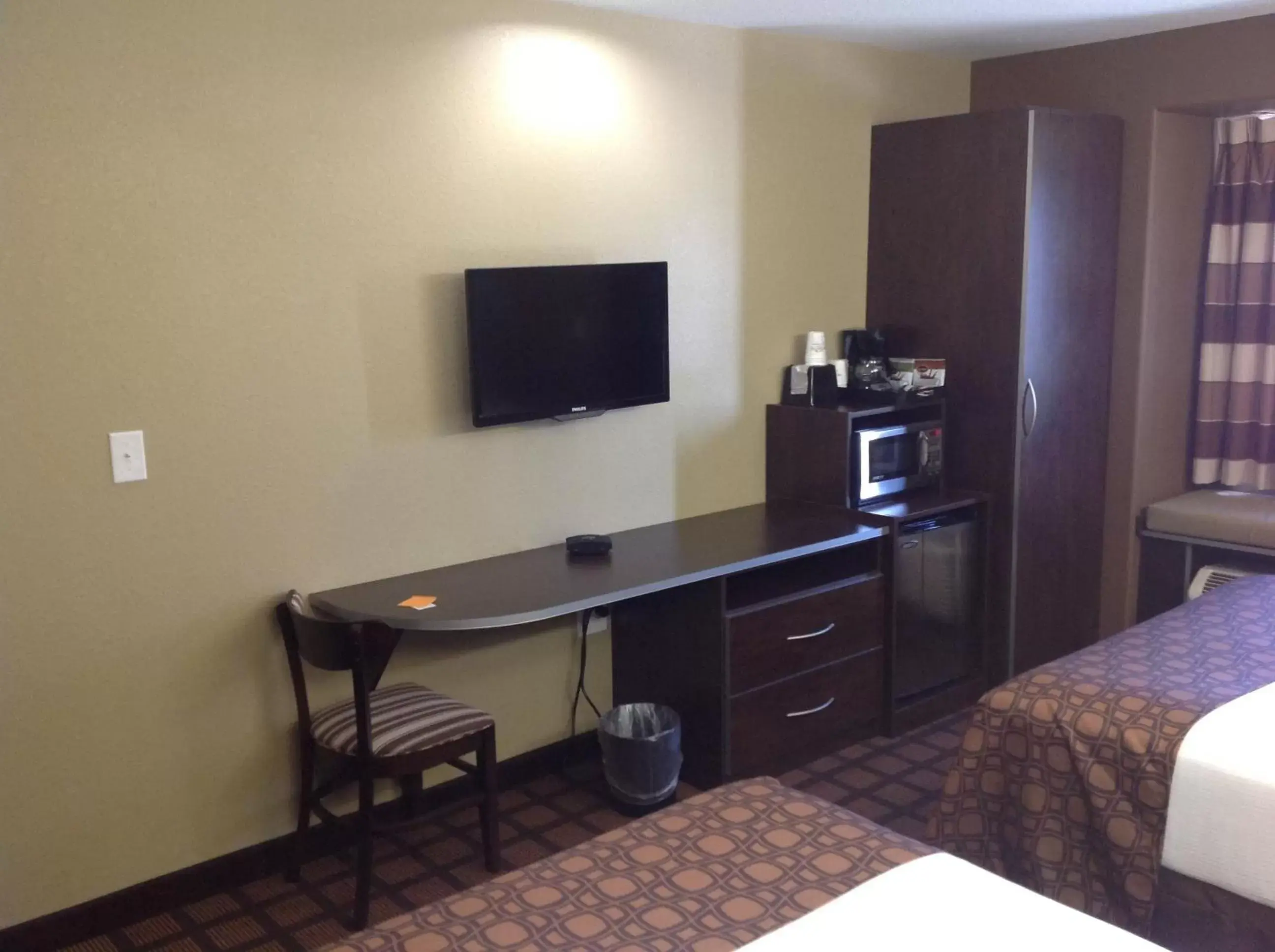 Bedroom, TV/Entertainment Center in Microtel Inn & Suites Gonzales TX