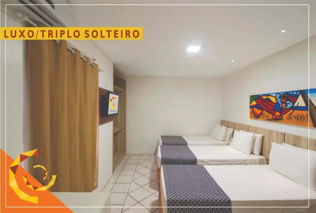 Bed in Netuanah Praia Hotel