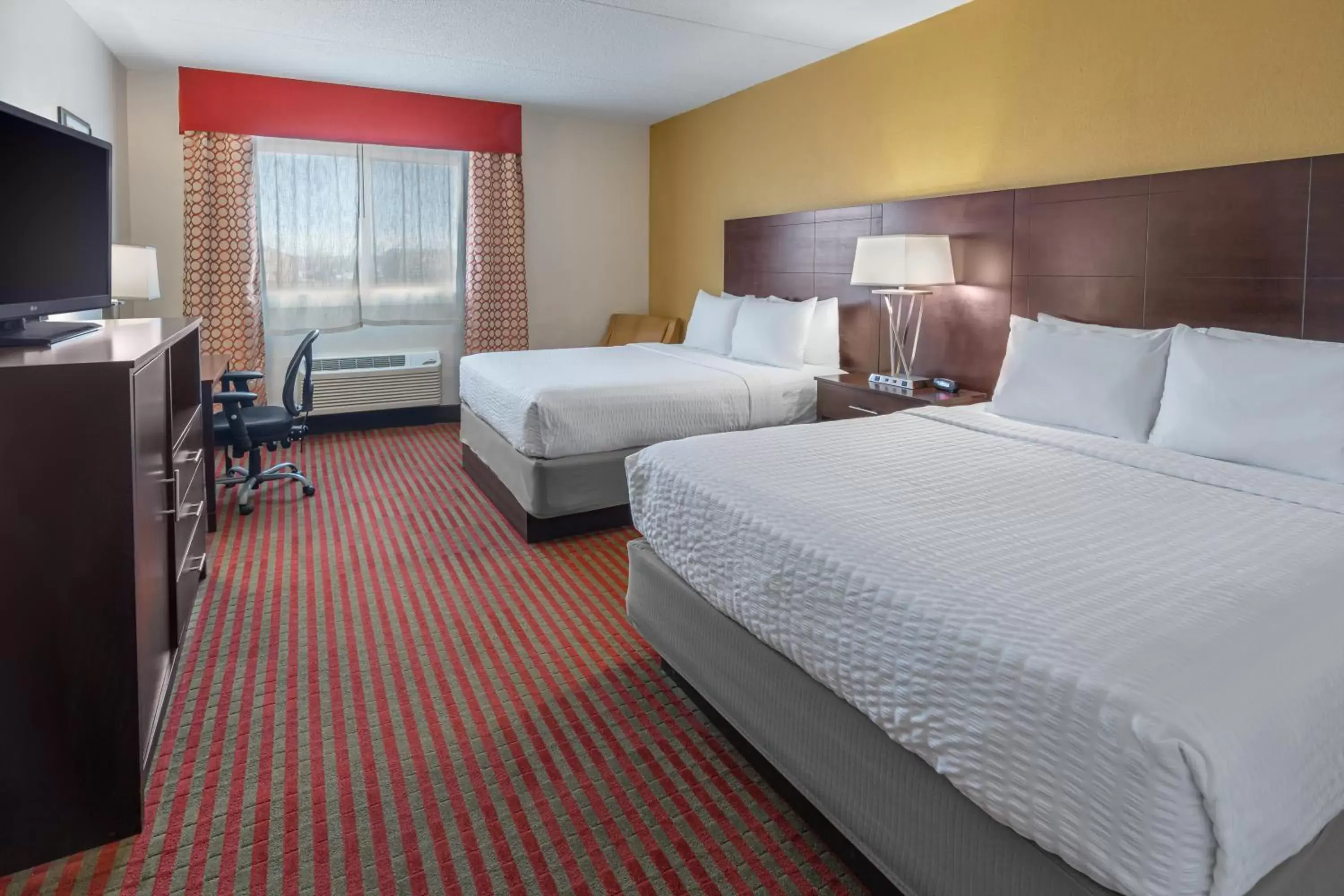 Bed in Grand Williston Hotel and Conference Center