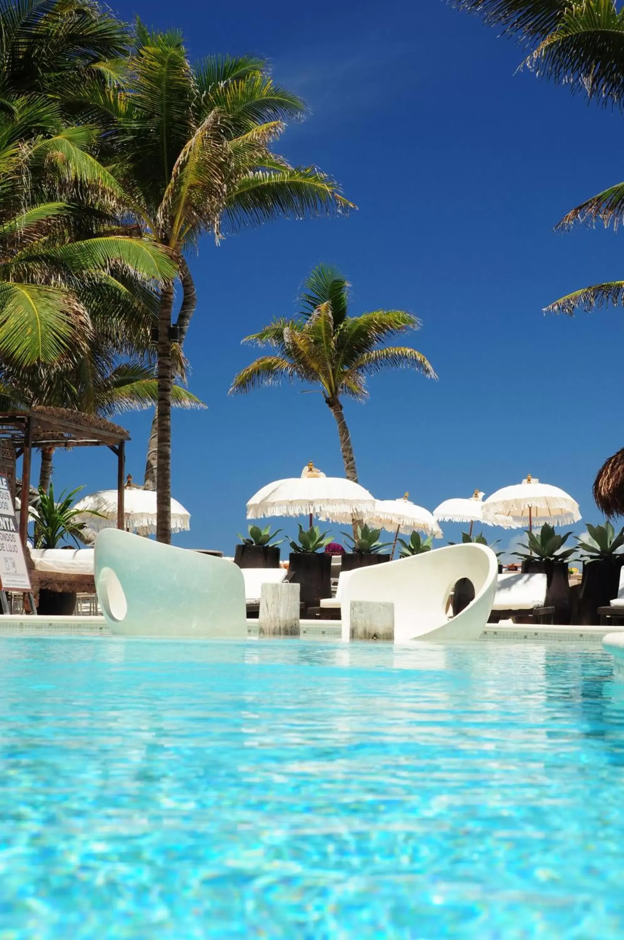 Toilet, Swimming Pool in El Taj Oceanfront and Beachside Condo Hotel