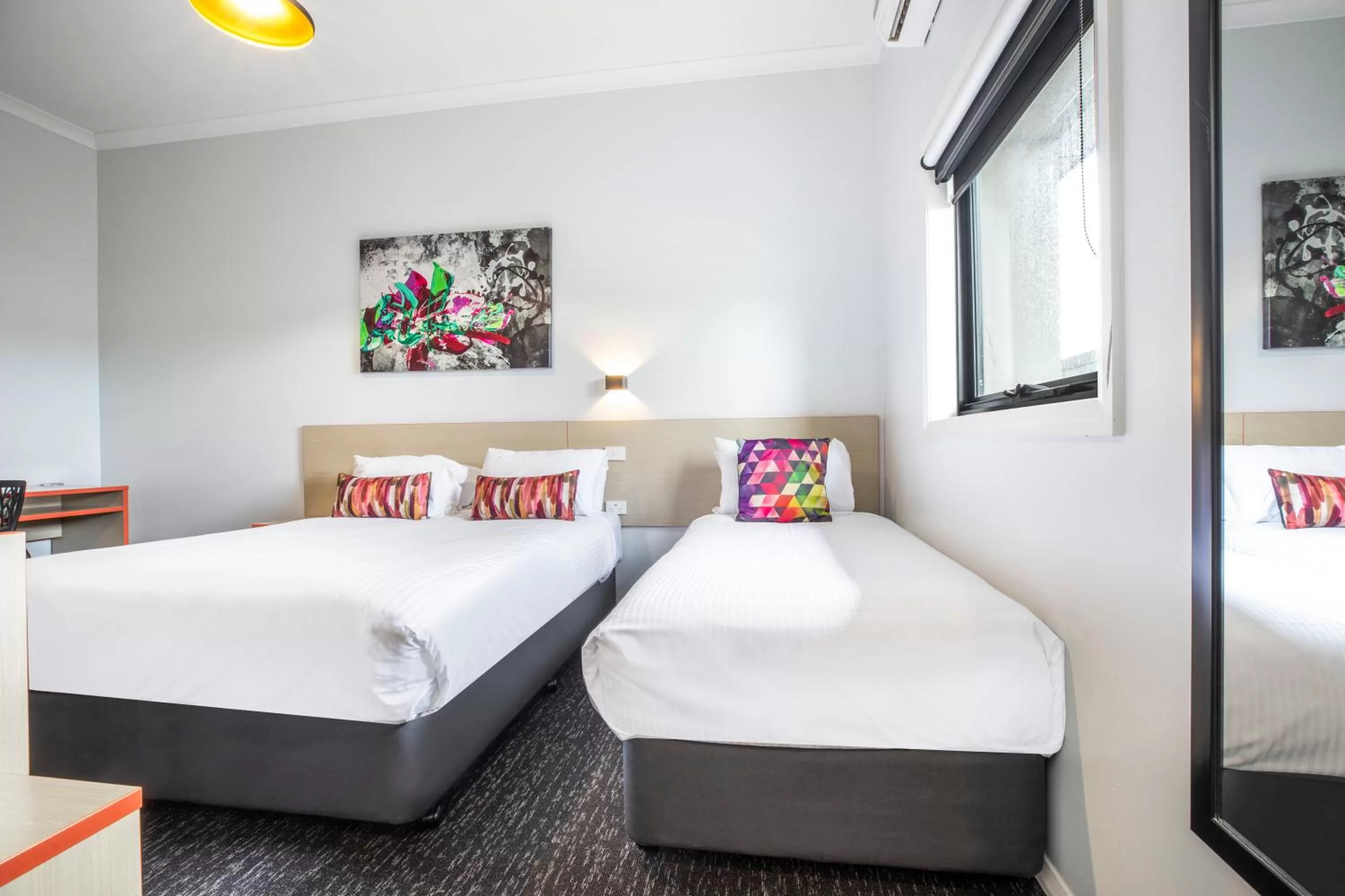 Bedroom, Bed in Nightcap at Ashley Hotel