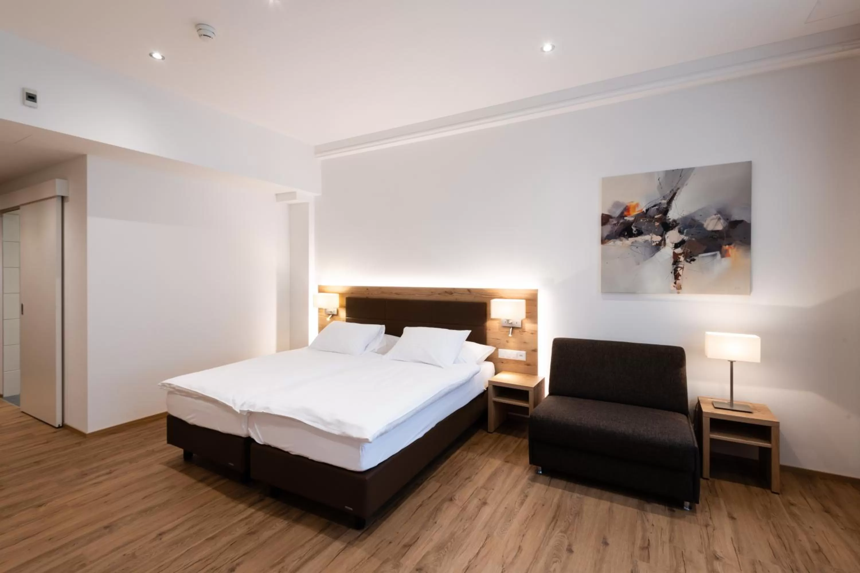 Bed in Central City Hotel Rochat