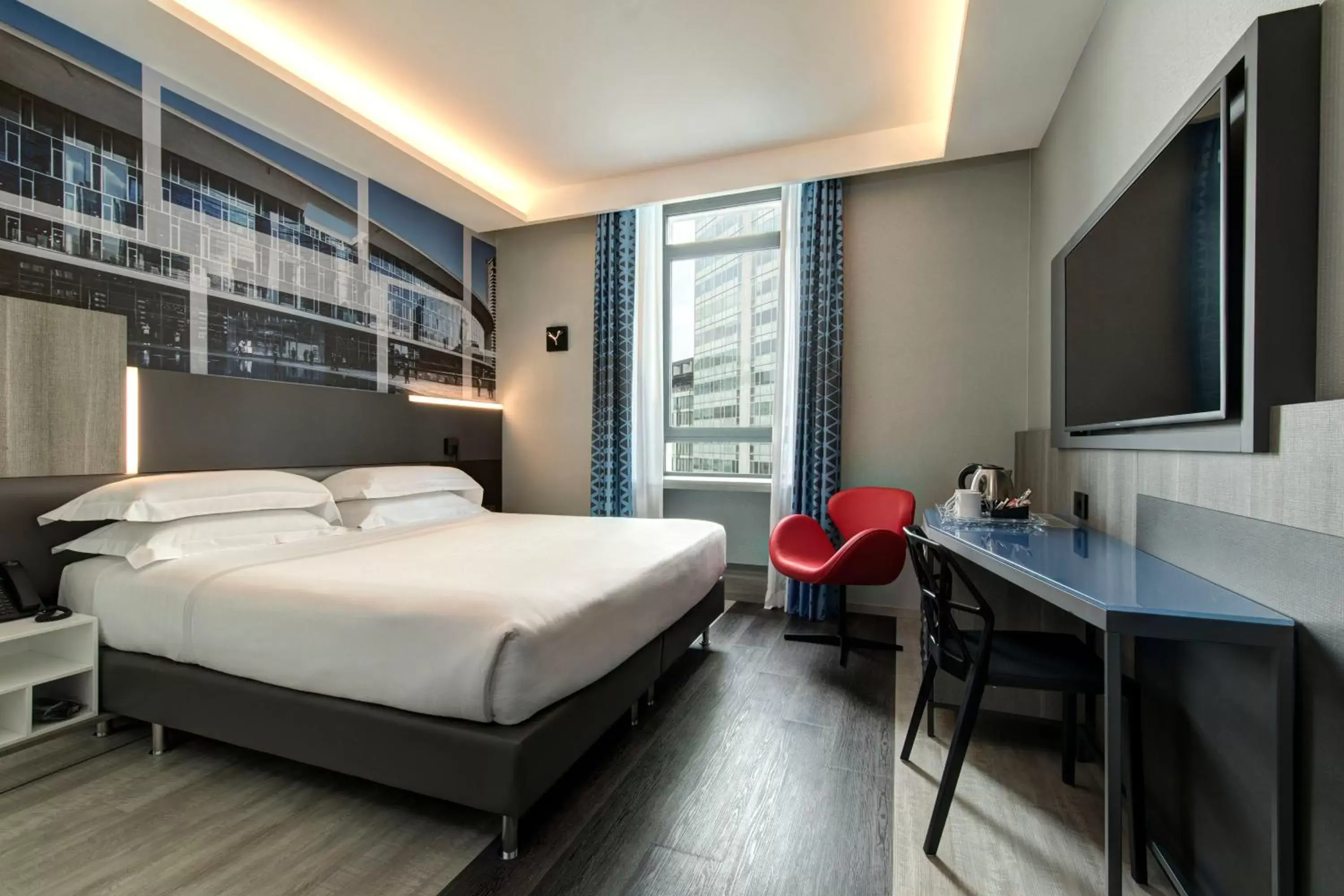 Bed in iQ Hotel Milano