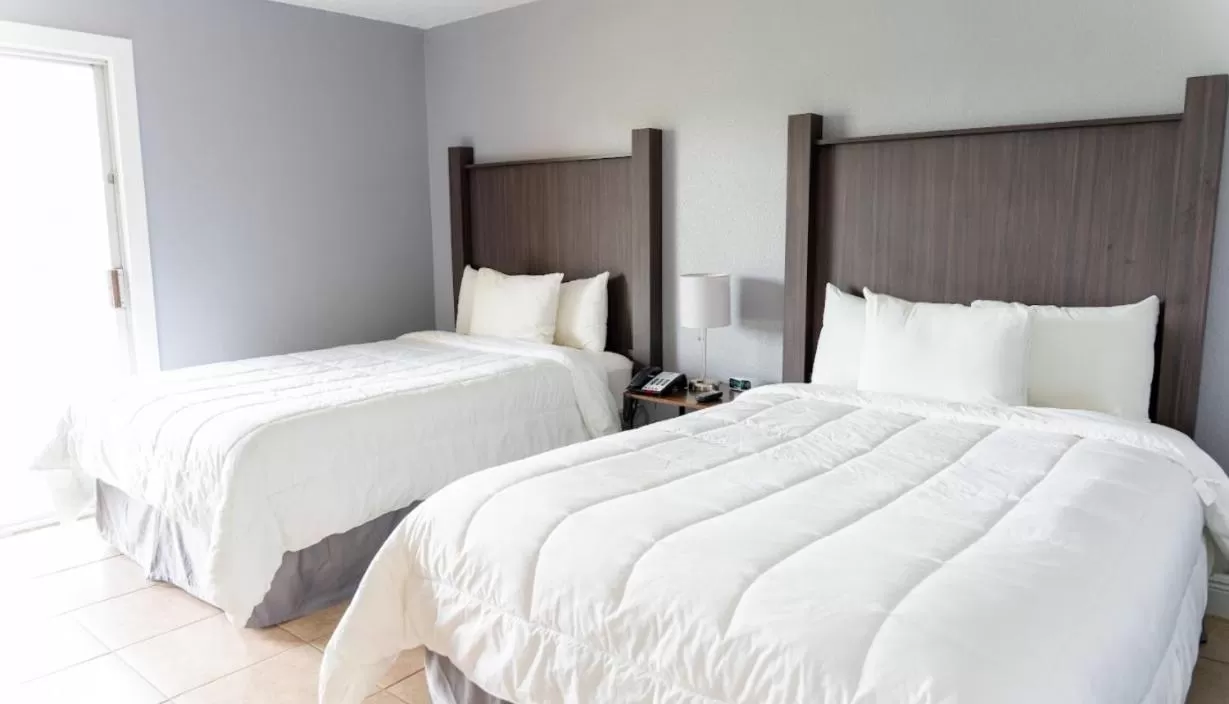 Bed in Celebration Suites 2 Bedroom Condo