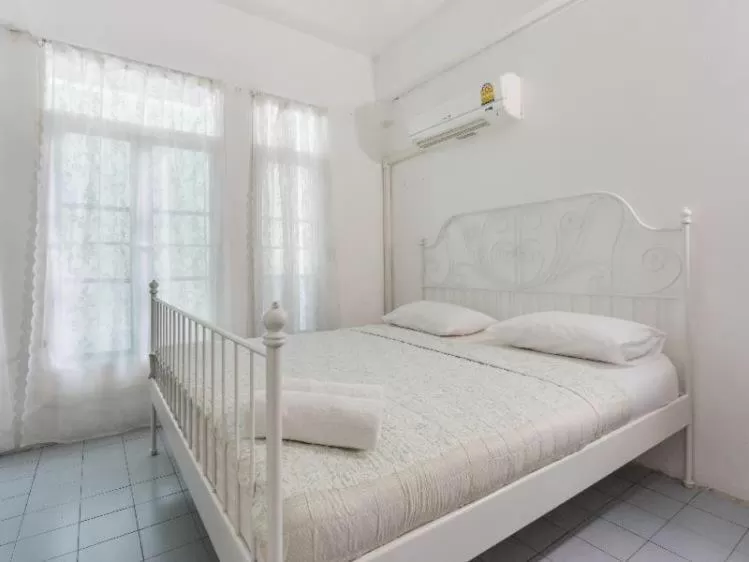 Bed in Oriental Smile Hotel