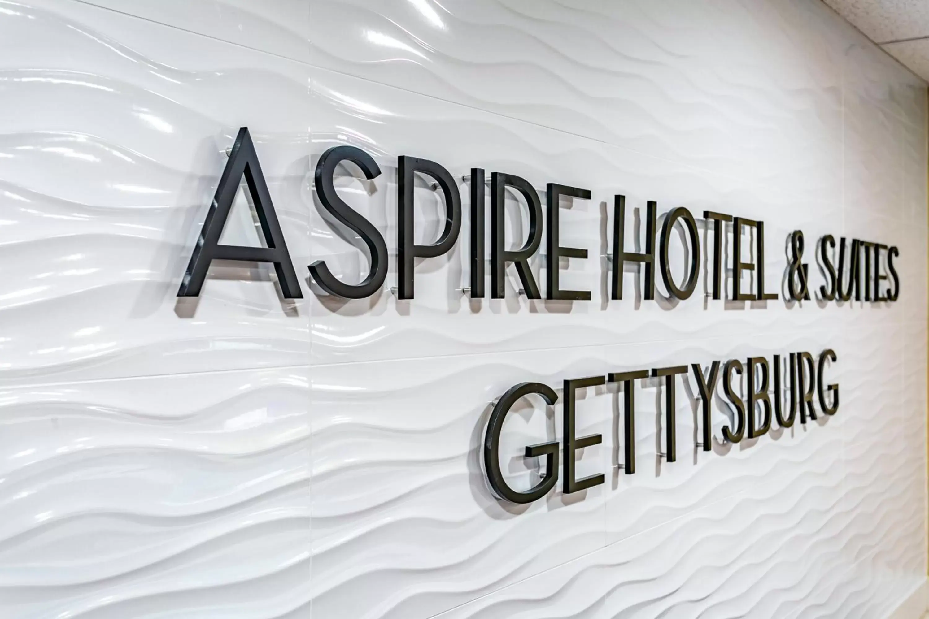 Logo/Certificate/Sign in Aspire Hotel and Suites