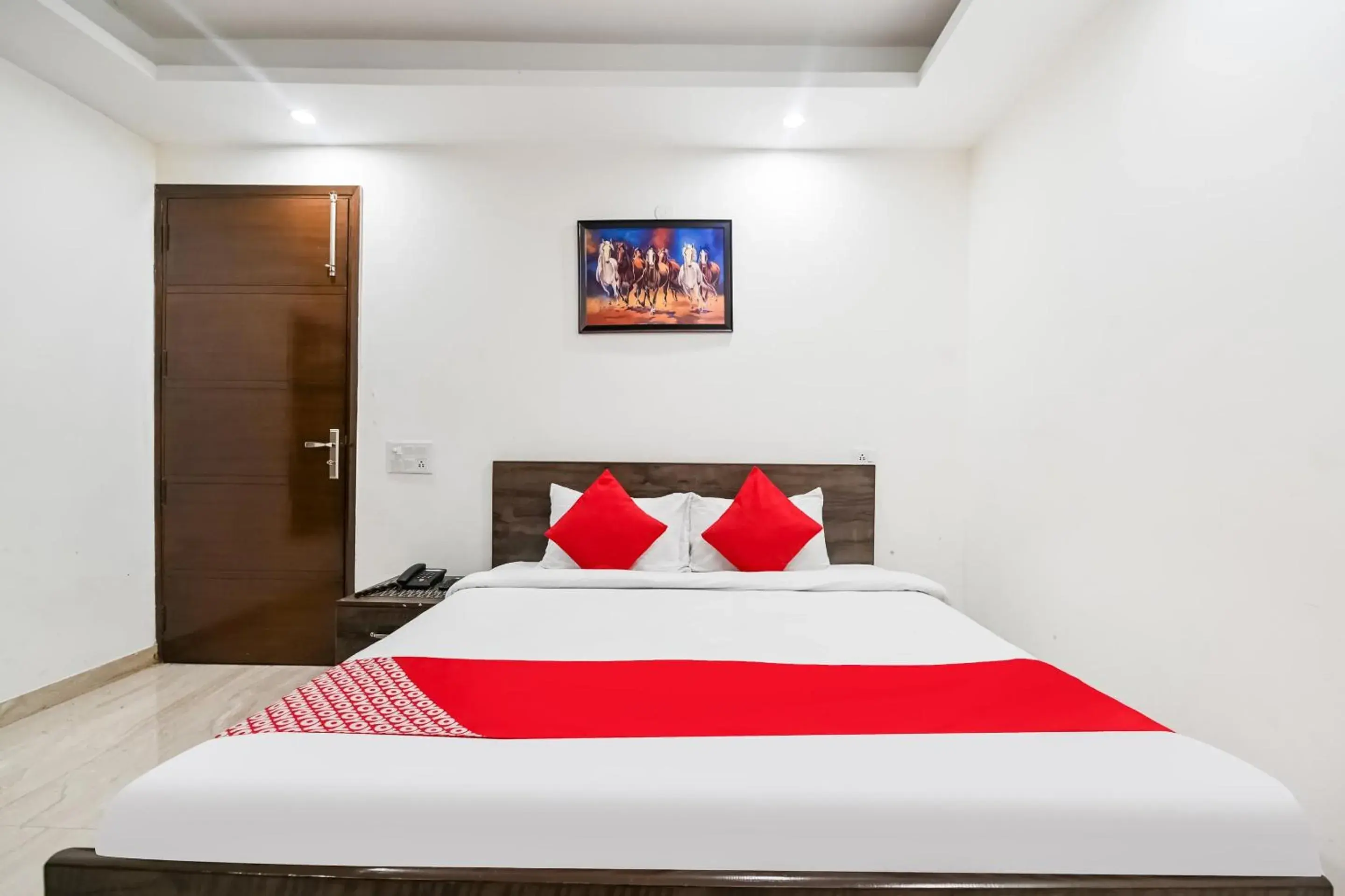 Bedroom, Bed in OYO White Rose Wallon Hotel Near Qutab Minar Metro Station
