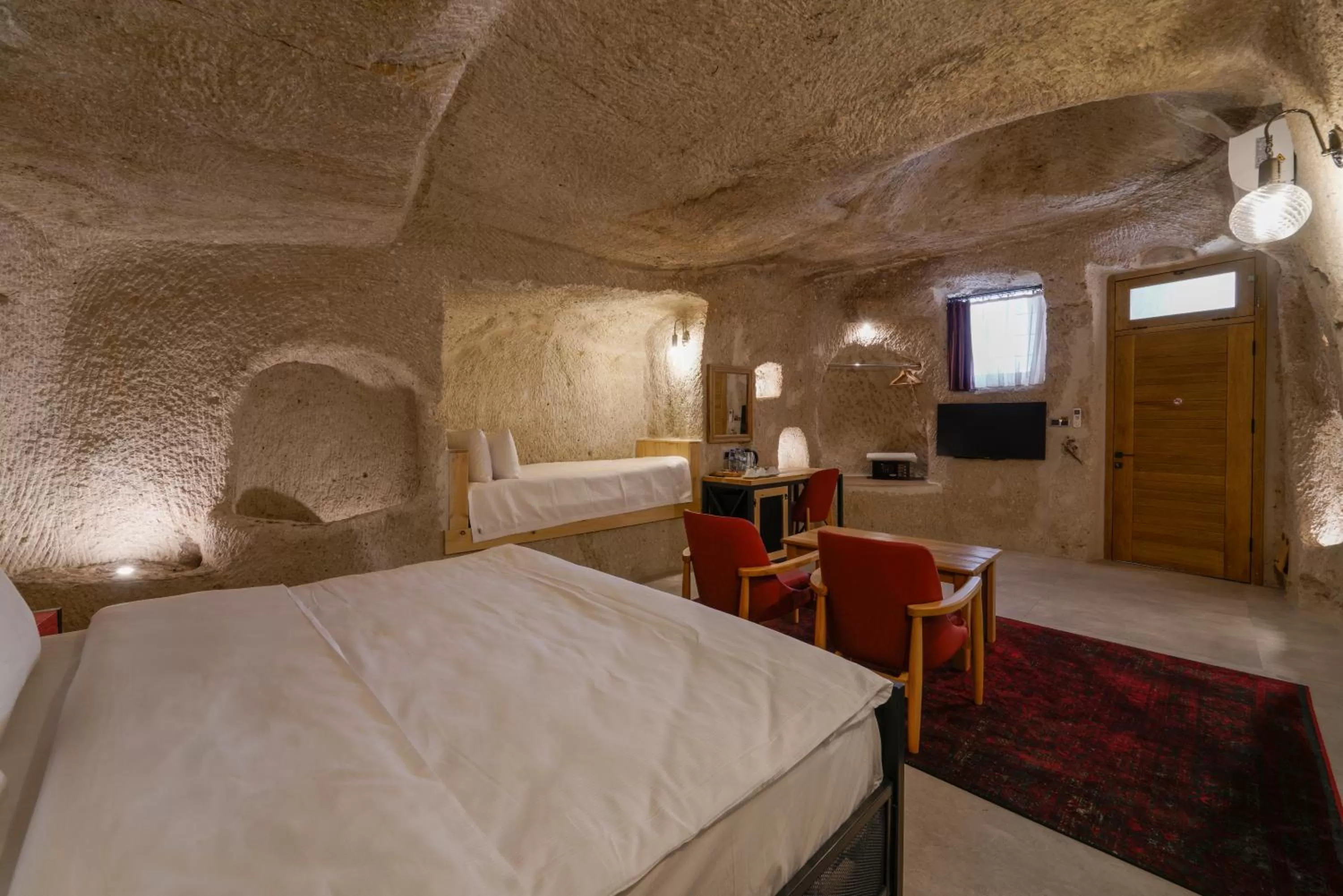 Bed in The Niche Cave Hotel