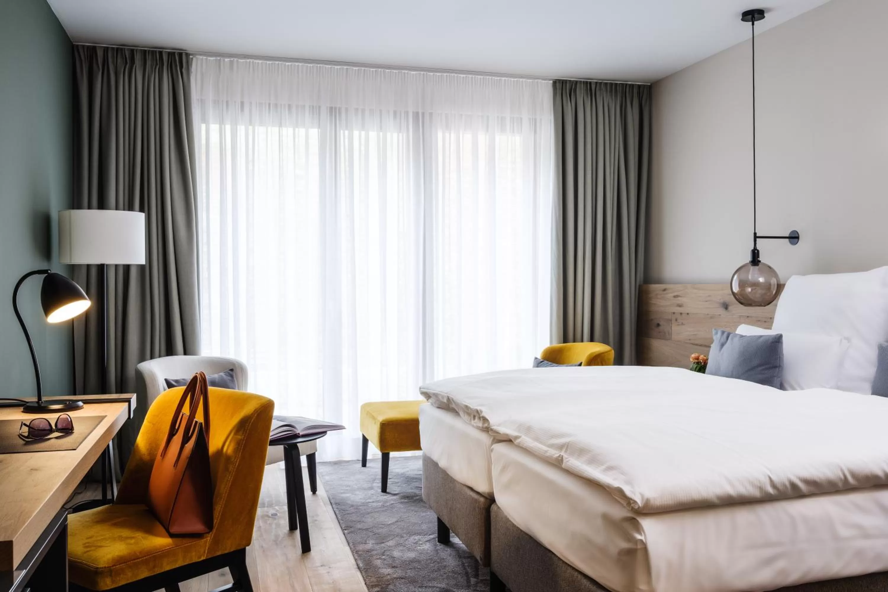 Photo of the whole room, Bed in AMERON Neuschwanstein Alpsee Resort & Spa