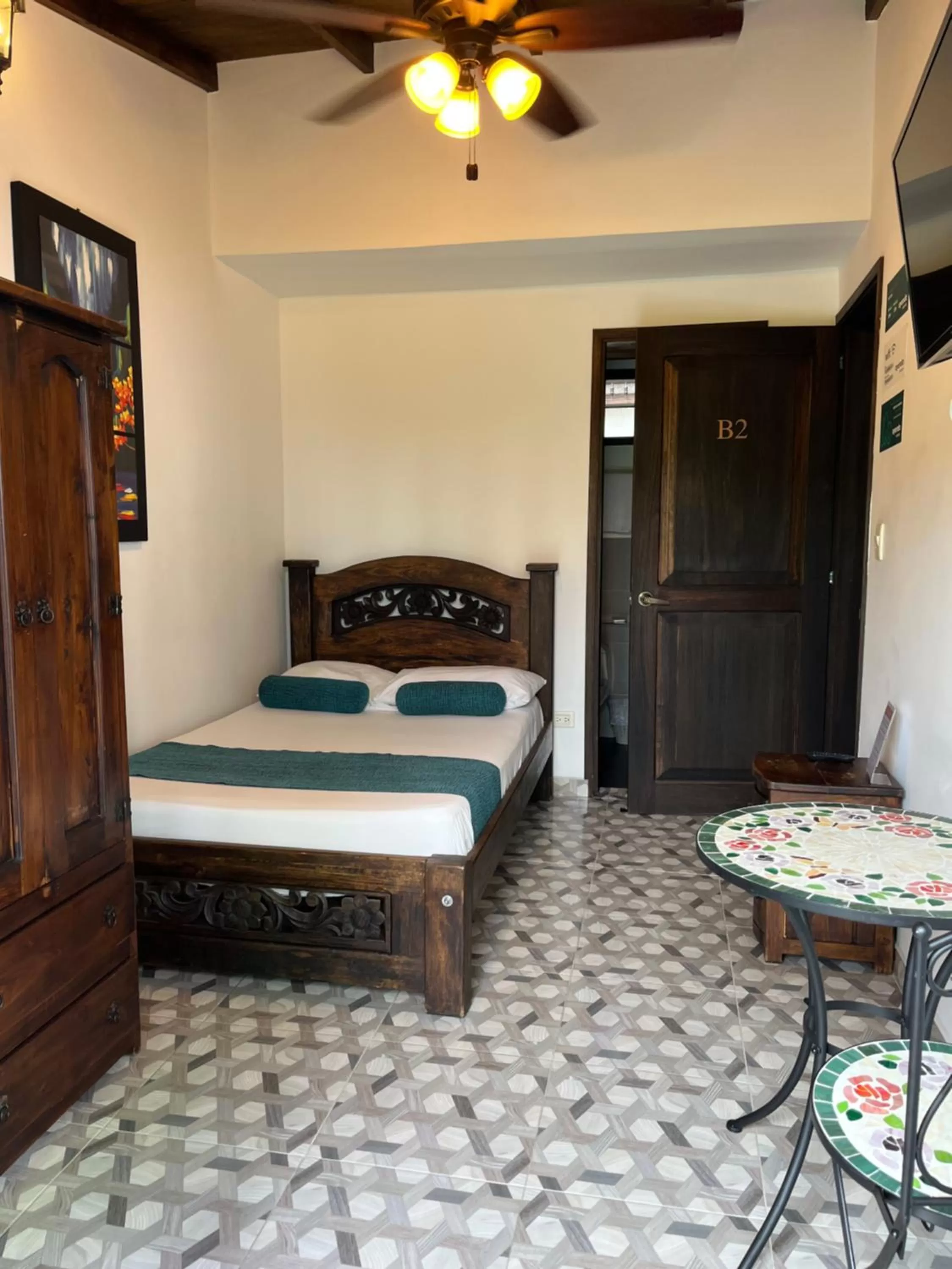 Photo of the whole room, Bed in Santiago DC Hotel