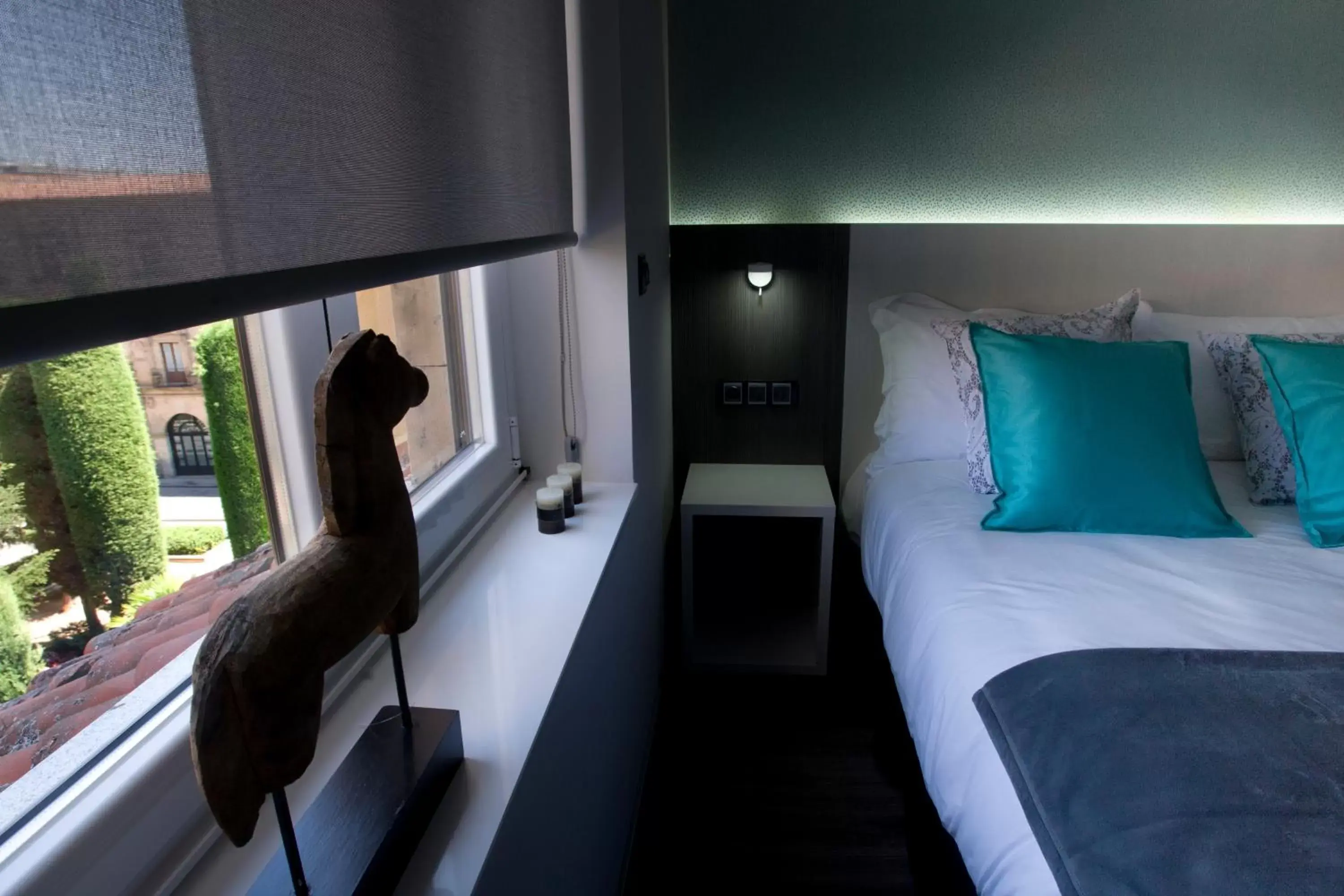 Decorative detail, Bed in Salamanca Suite Studios Decorative detail, Bed in Salamanca Suite Studios