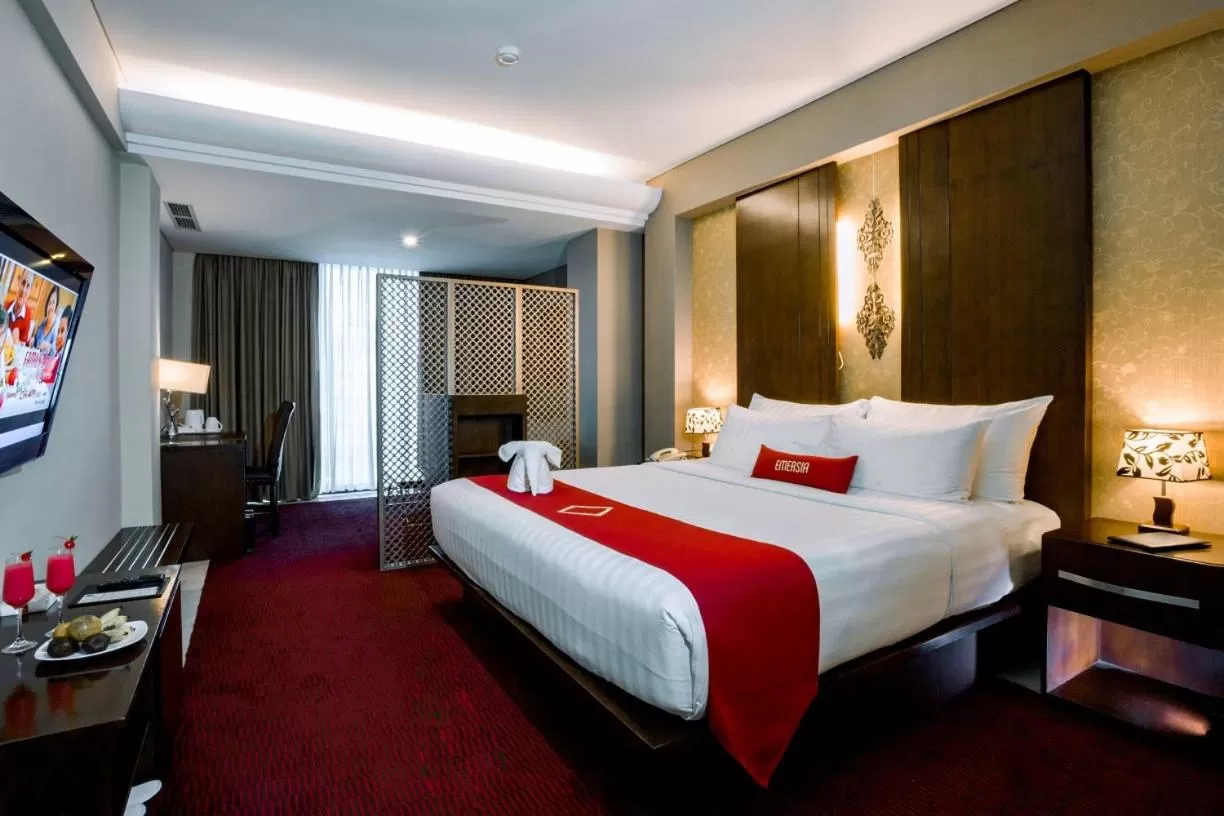 Bed in Emersia Hotel and Resort