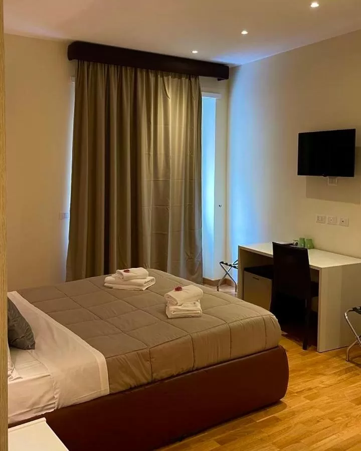 Bed in Rienzo Vatican Suites