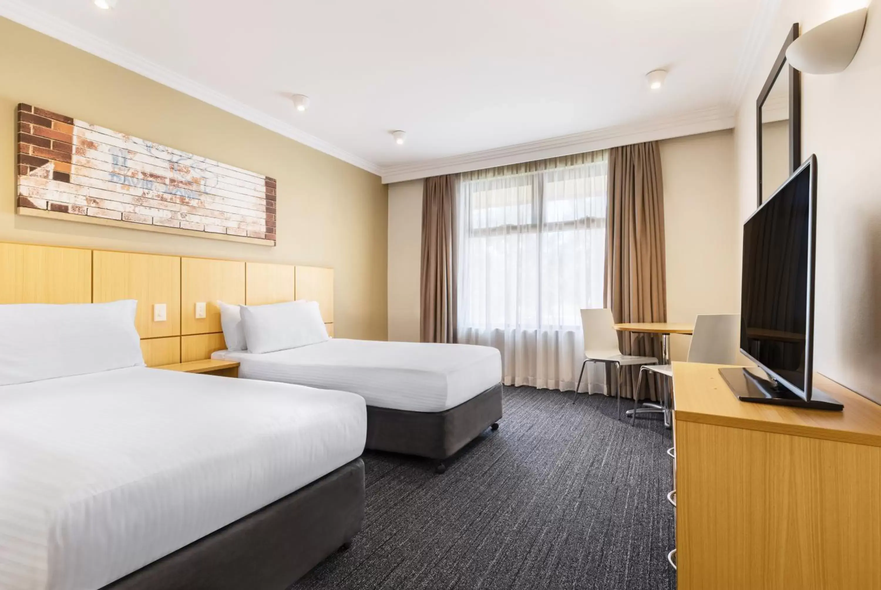 Bed in Mercure Sydney Blacktown