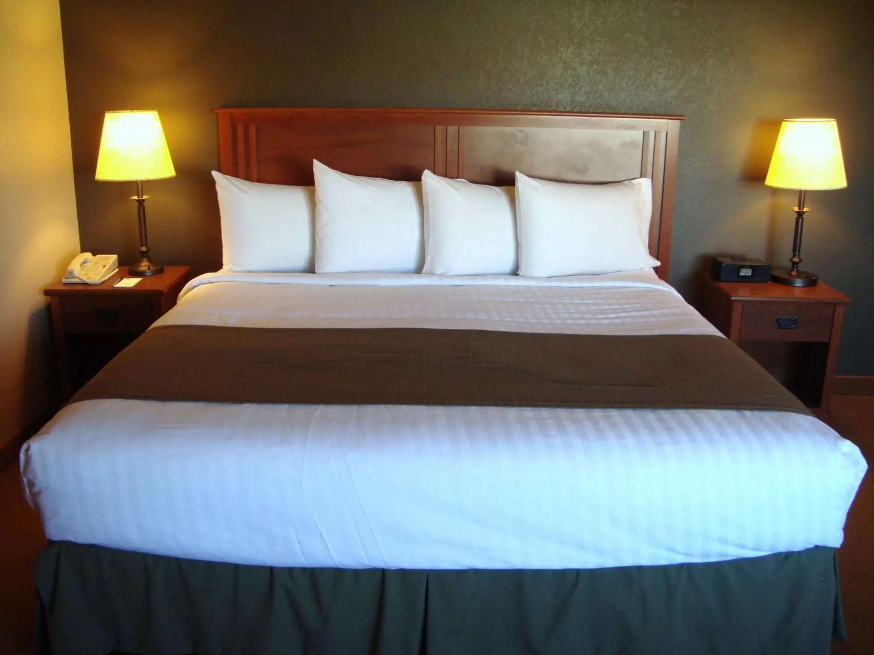 Bed in AmericInn by Wyndham Sioux City