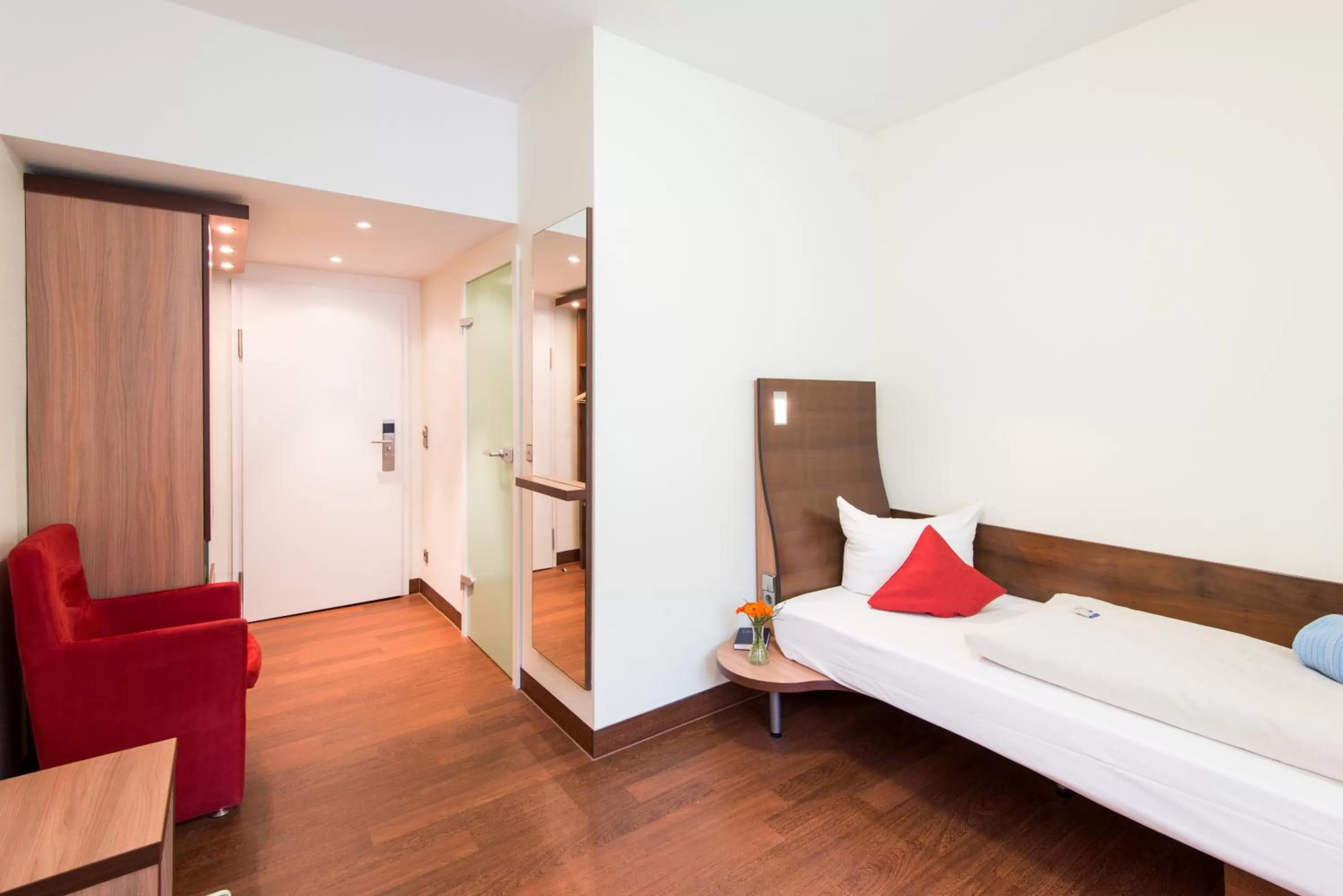 Photo of the whole room, Bed in Stadthotel Freiburg Kolping Hotels & Resorts