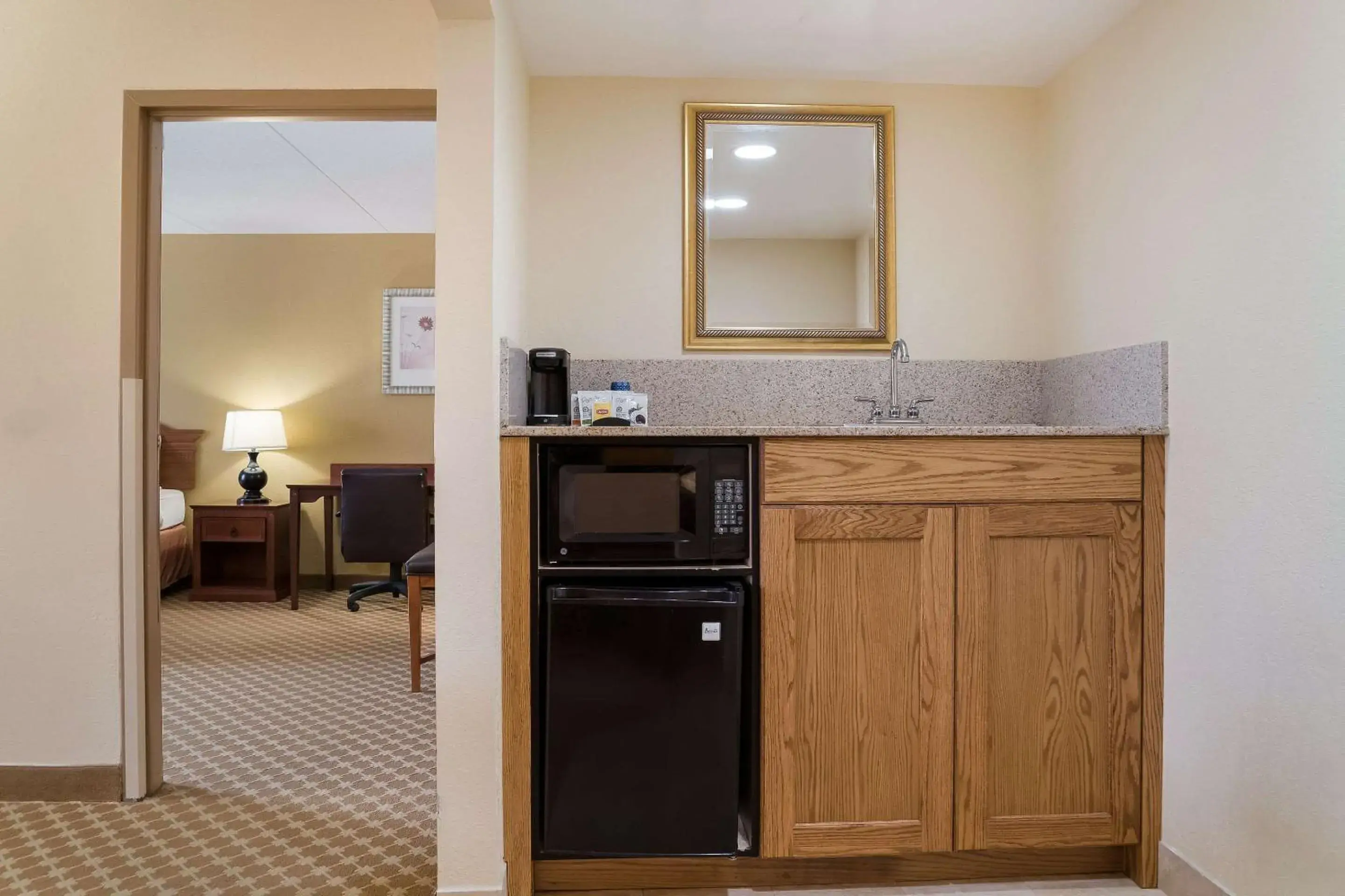 Bedroom, Kitchen/Kitchenette in Quality Inn & Suites