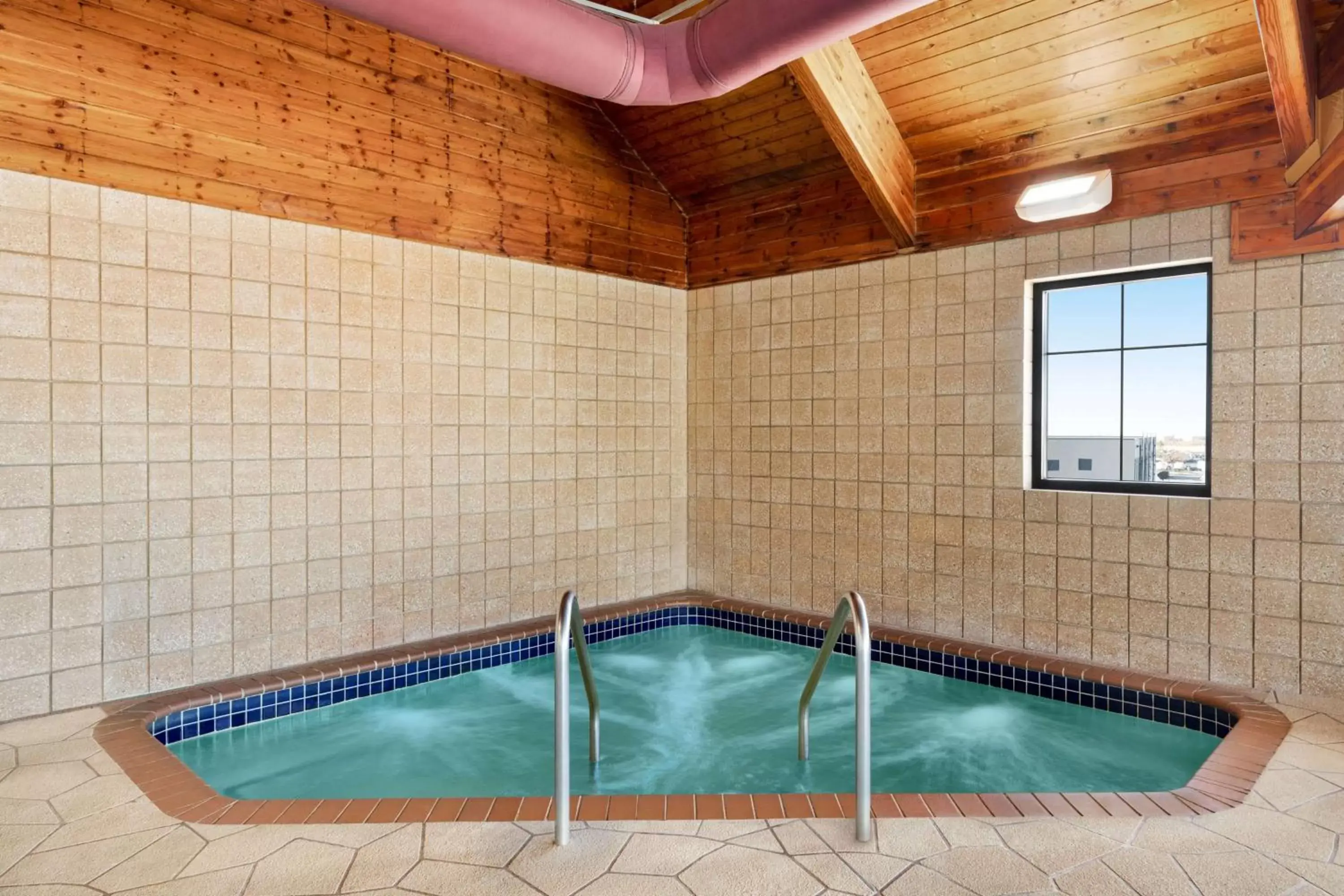 Hot Tub, Swimming Pool in AmericInn by Wyndham Laramie Near University of Wyoming