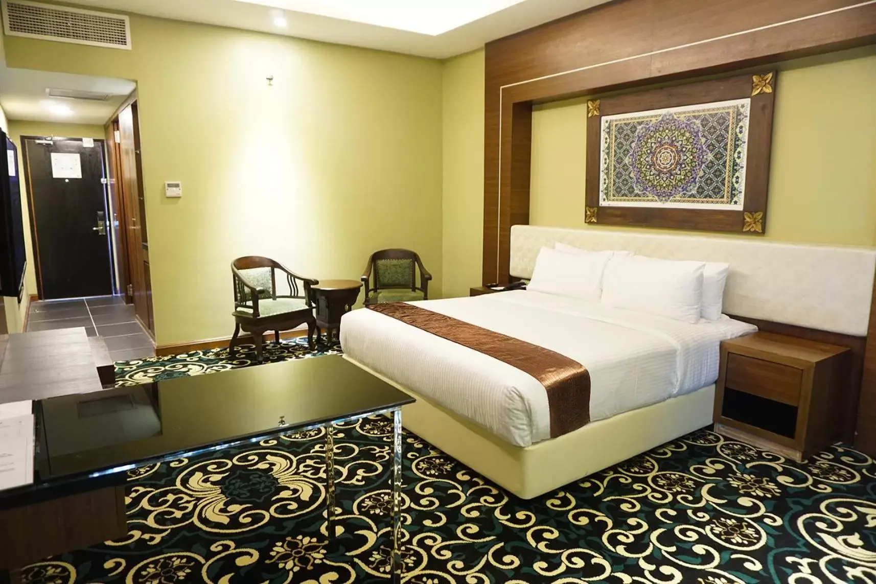 Bed in Mudzaffar Hotel